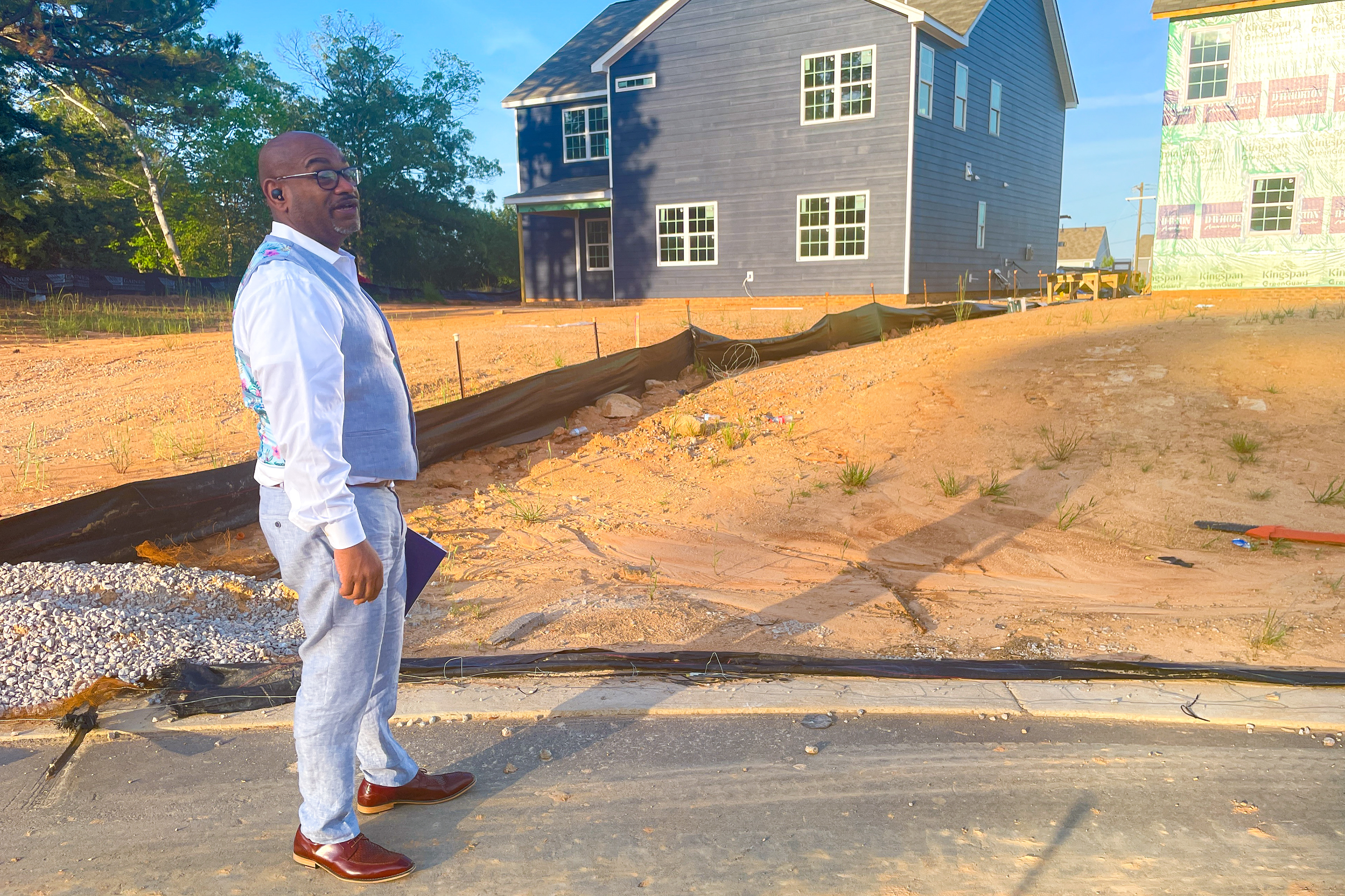 Shawn Mclean shows how homes begin and the soon-to-be finished outcome in Knightdale, NC on April 24, 2023. Buyers are invited to inspect their properties to obtain a complete scope of construction and any mistakes that may occur. (Photo by Jamesha Robinson)
