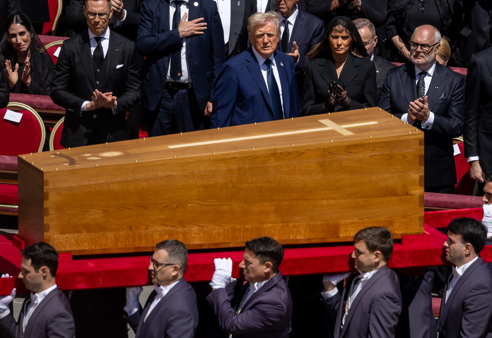 Pallbearers carry the casket of Pope Francis past U.S. President Donald J. Trump, First Lady Melania Trump and other dignitaries in St. Peter's Square at the end of his funeral Mass April 26, 2025. (CNS photo/Pablo Esparza)