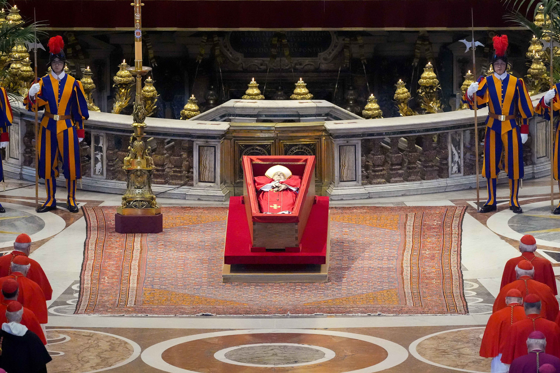 The body of Pope Francis lies in an open casket in front of the Altar of the Confession in St. Peter’s Basilica at the Vatican April 23, 2025. The pope will lie in state for three days of public viewing and prayer ahead of his funeral Mass April 26. (CNS photo/Lola Gomez)