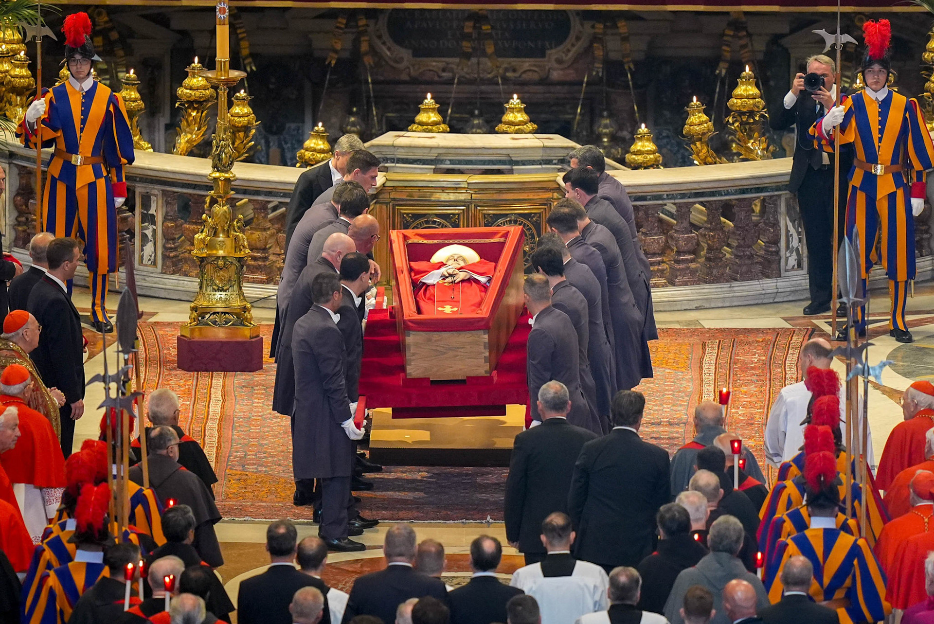 Pallbearers place the body of Pope Francis, lying in an open casket, before the Altar of the Confession in St. Peter’s Basilica at the Vatican April 23, 2025. The pope will lie in state for public viewing and prayer for three days before his funeral Mass April 26. (CNS photo/Lola Gomez)