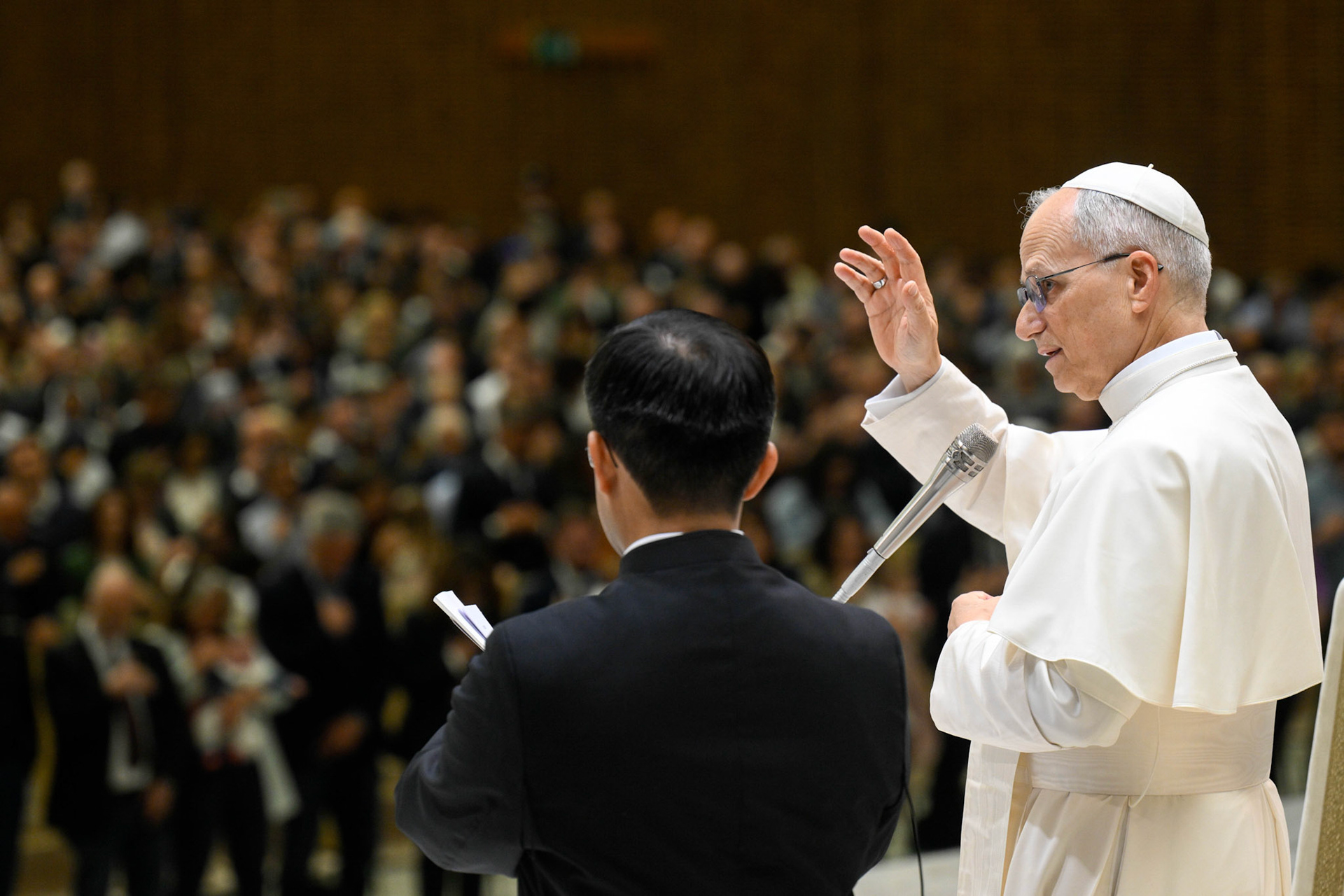 Pope Leo XIV gives his blessing to officials and employees of the Roman Curia, Vatican City State and the Diocese of Rome during a meeting in the Paul VI Audience Hall at the Vatican May 24, 2025. (CNS photo/Vatican Media)