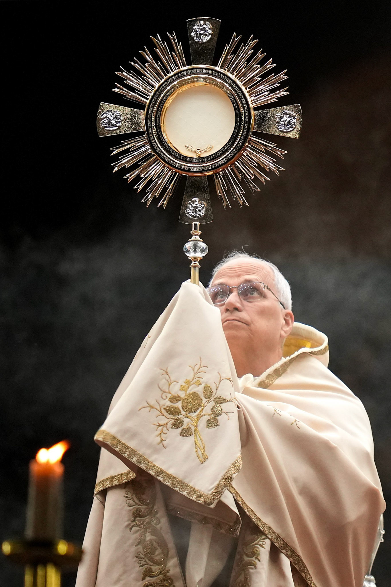 Pope Leo XIV elevates the monstrance containing the Blessed Sacrament for Benediction at the end of a prayer vigil and recitation of the rosary for peace in St. Peter’s Square at the Vatican Oct. 11, 2025. (CNS photo/Lola Gomez)