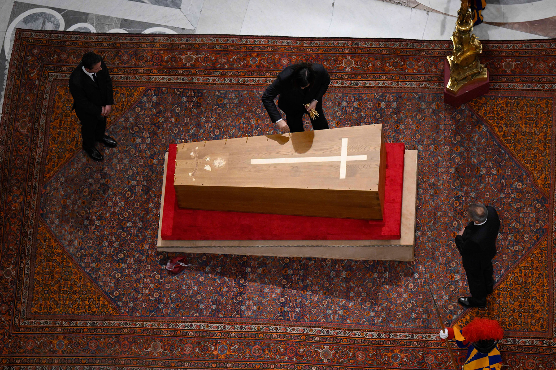 Vatican employees prepare to nail a wooden cover over the zinc-lined casket of the late Pope Francis during a prayer service in St. Peter's Basilica at the Vatican April 25, 2025. (CNS photo/Vatican Media)
