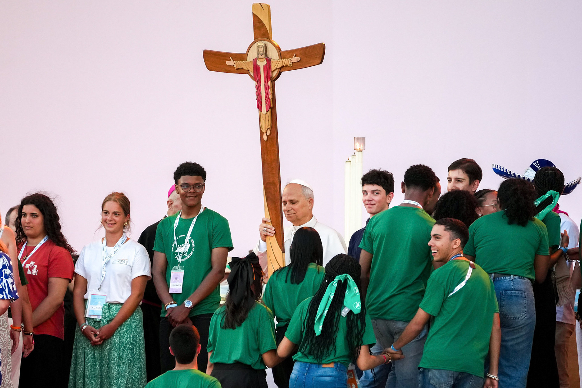 Pope Leo XIV holds the Jubilee Cross as young people gather around him during a prayer vigil at Tor Vergata in Rome Aug. 2, 2025, part of the Jubilee of Youth celebrations. (CNS photo/Lola Gomez)