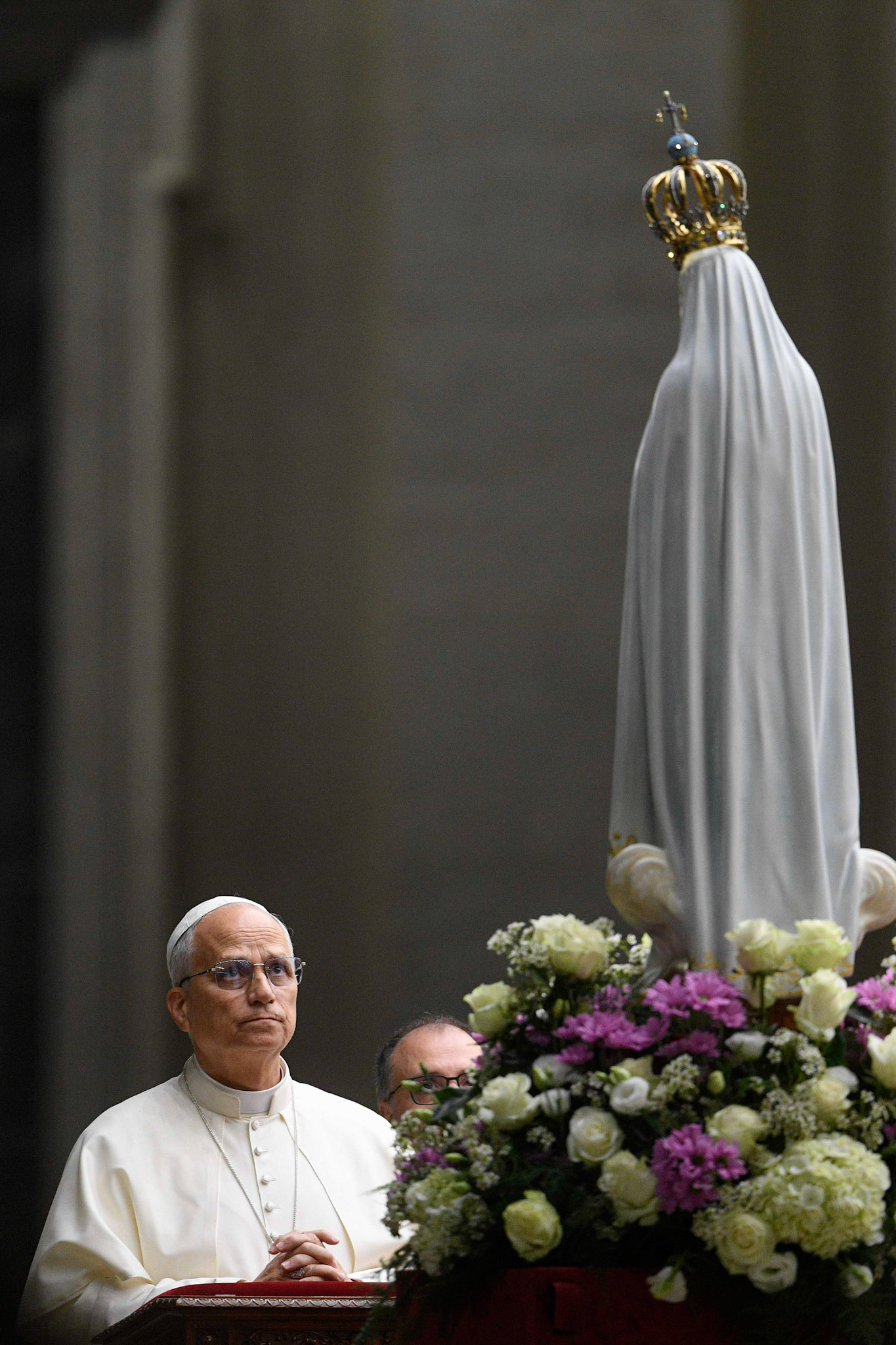Pope Leo XIV kneels in prayer before the original statue of Our Lady of Fatima in St. Peter's Square at the Vatican Oct. 11, 2025, before a prayer vigil and the recitation of the rosary for peace. The statue was brought from Portugal to Rome for the Jubilee of Marian Spirituality. (CNS photo/Vatican Media)