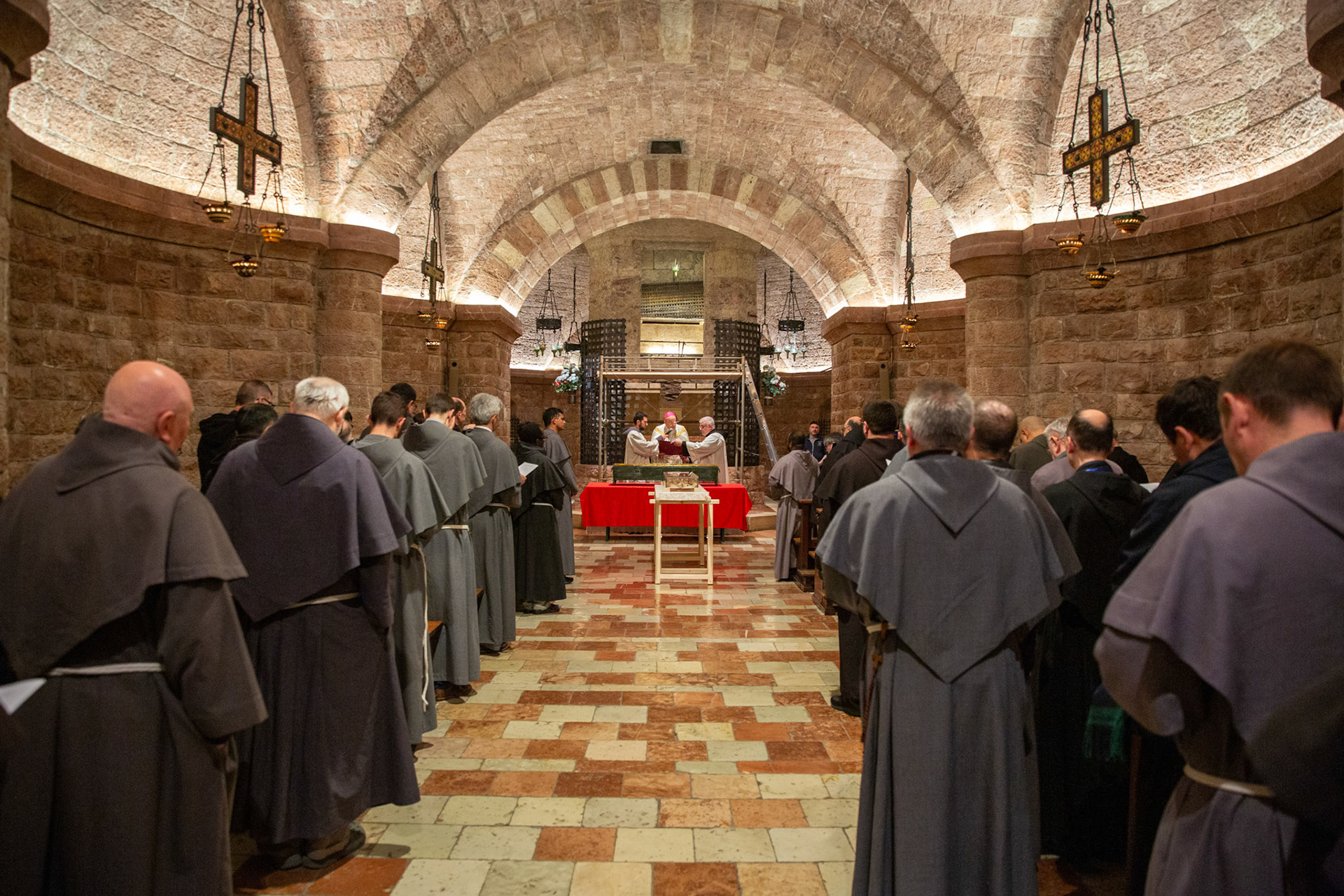 Franciscan friars gather for a final moment of prayer with the relics of St. Francis of Assisi on the evening of March 22, 2026, before his mortal remains were carried in procession from the Lower Church of the Basilica of St. Francis of Assisi to the crypt, ending a monthlong public veneration of the relics. (OSV News photo/courtesy Basilica of St. Francis of Assisi)