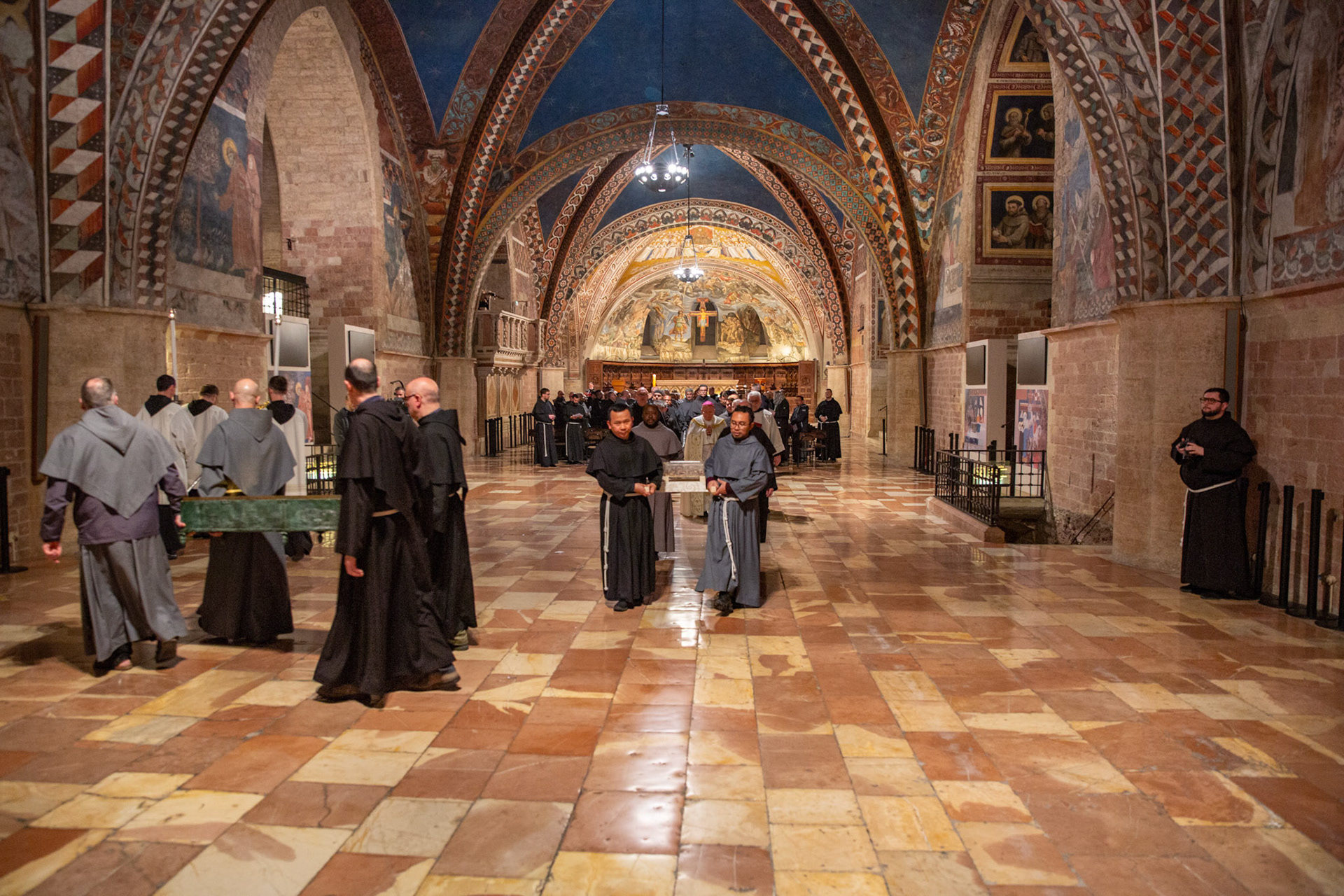Franciscan friars carry the mortal remains of St. Francis of Assisi in procession from the Lower Church of the Basilica of St. Francis of Assisi in Italy to the basilica's crypt after a monthlong period of public veneration ended March 22, 2026. (OSV News photo/courtesy Basilica of St. Francis of Assisi)