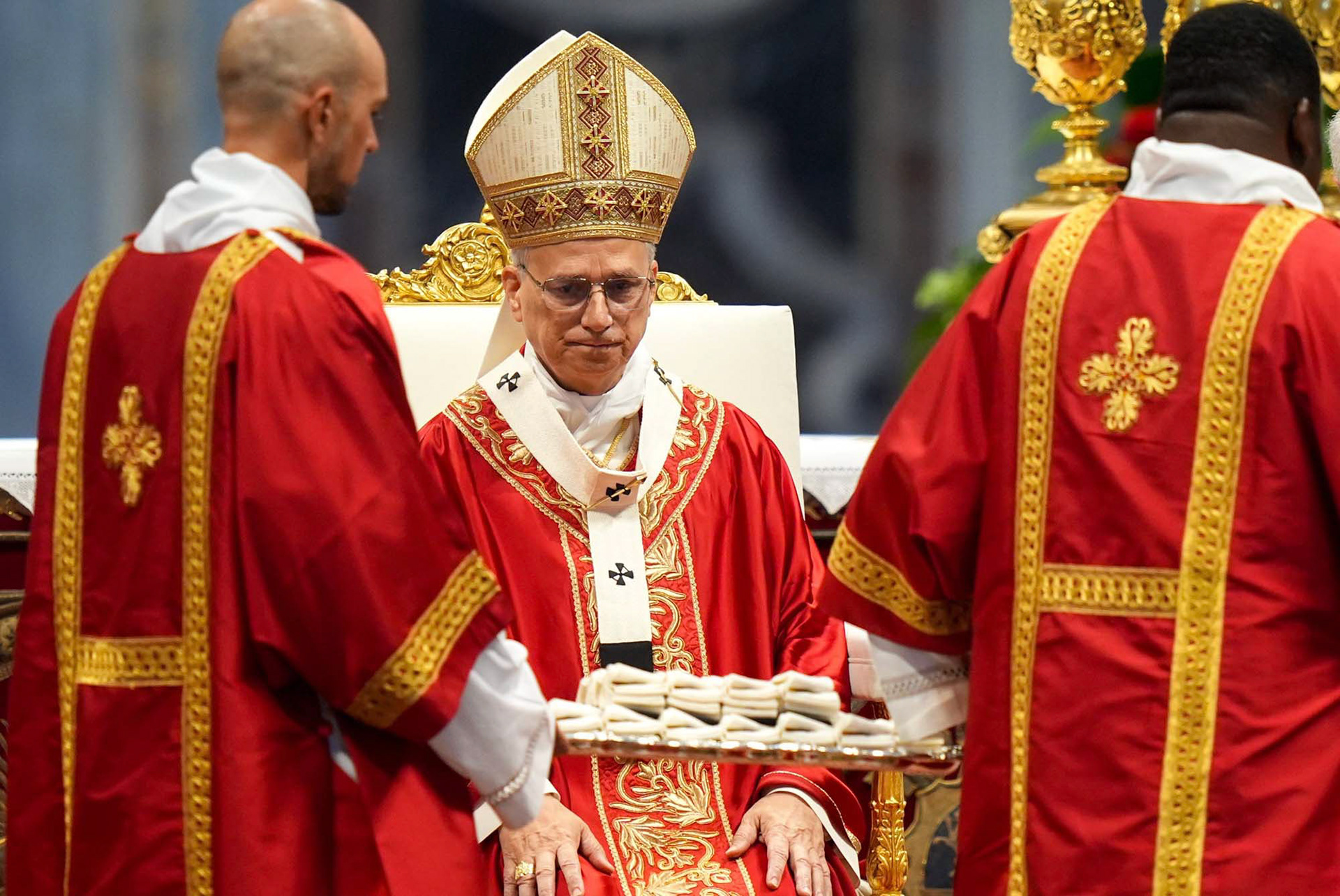 Deacons carry palliums from the crypt above the tomb of St. Peter to be blessed by Pope Leo XIV during Mass for the feast of Sts. Peter and Paul in St. Peter’s Basilica at the Vatican June 29, 2025. (CNS photo/Lola Gomez)