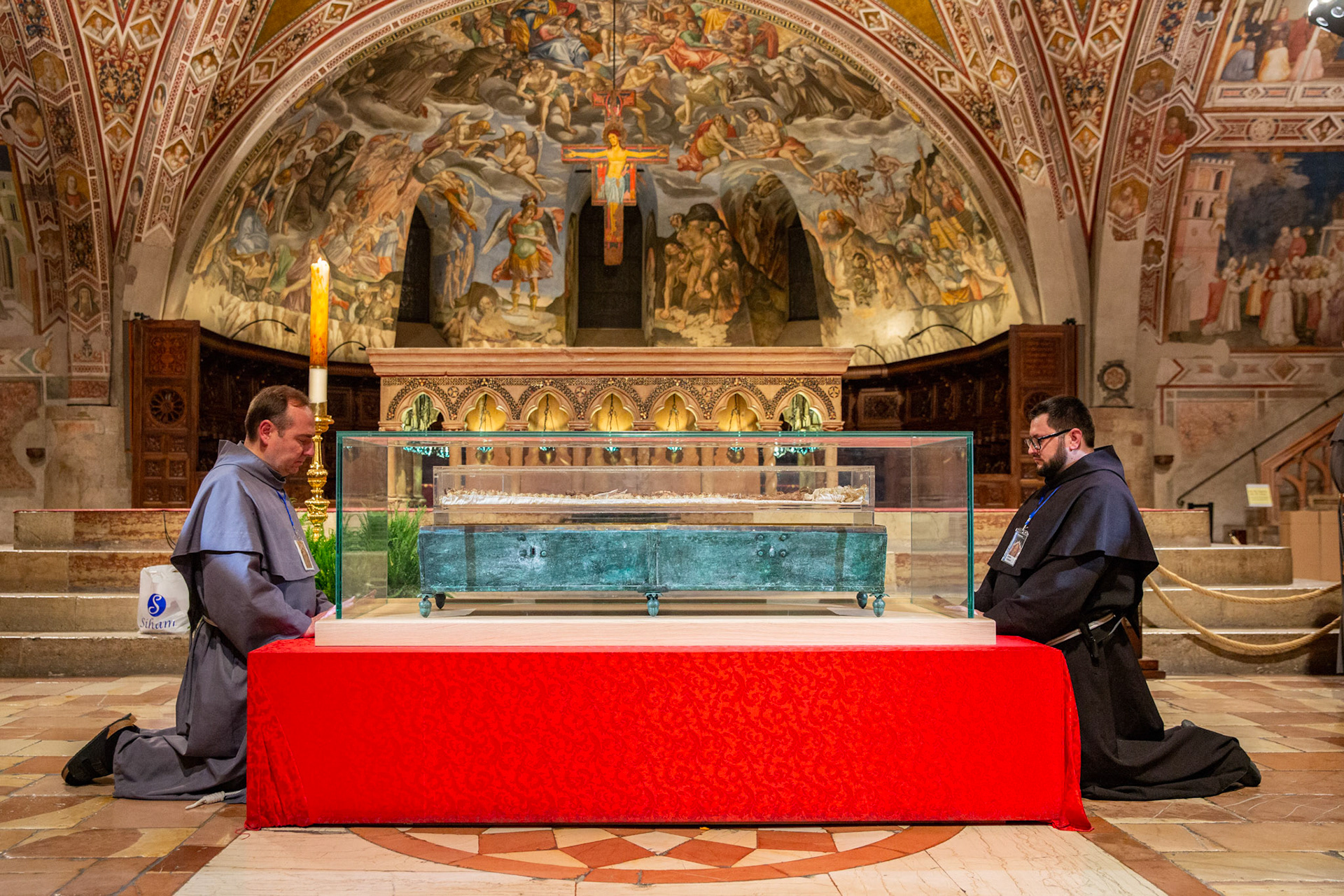 Franciscan friars kneel in prayer during the final moment of veneration of the relics of St. Francis of Assisi on March 22, 2026, in the Lower Church of the Basilica of St. Francis of Assisi. (OSV News photo/courtesy Basilica of St. Francis of Assisi)
