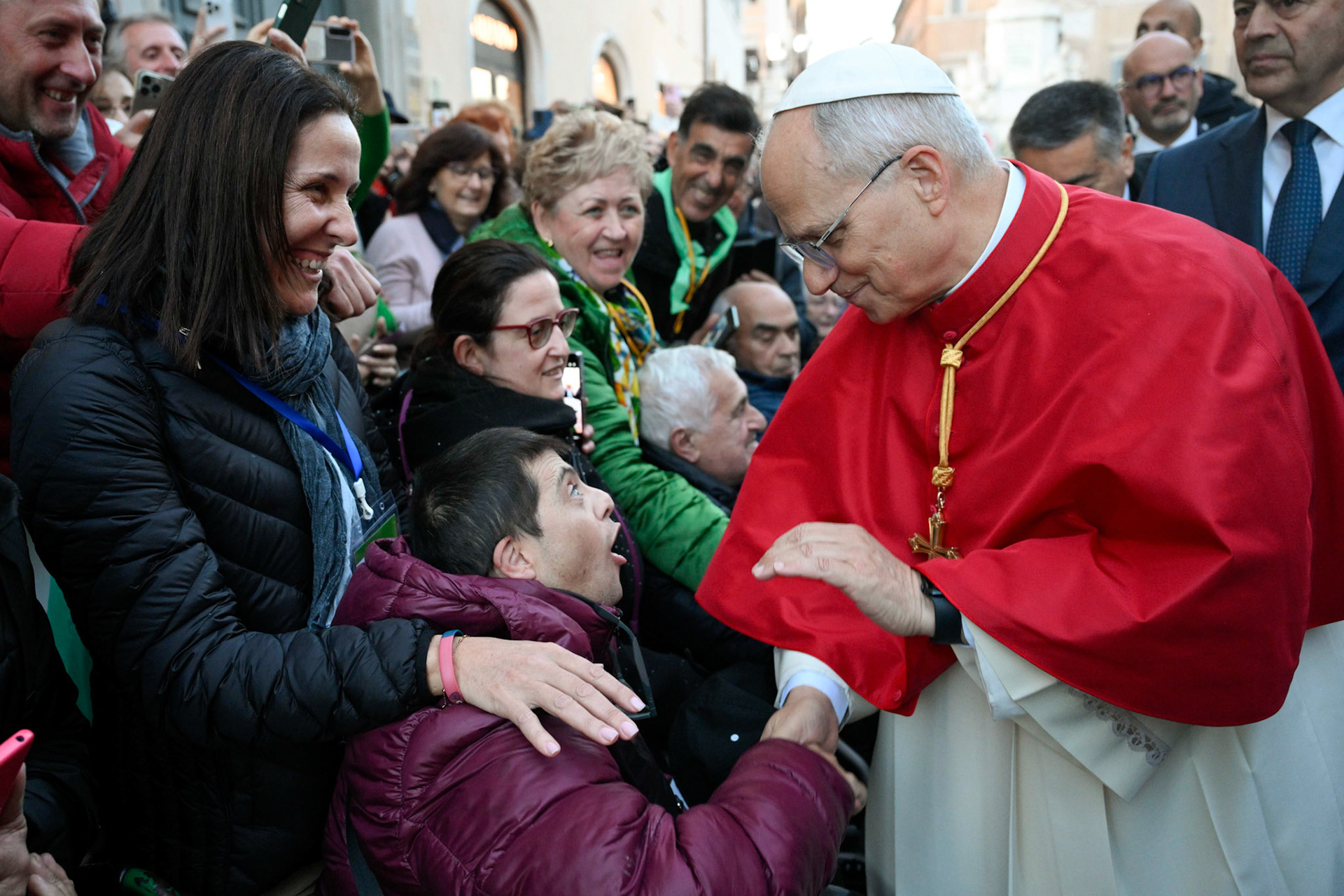 Pope Leo XIV greets people who came to pray with him by a Marian statue near the Spanish Steps in the center of Rome Dec. 8, 2025, the feast of the Immaculate Conception. (CNS photo/Vatican Media)
