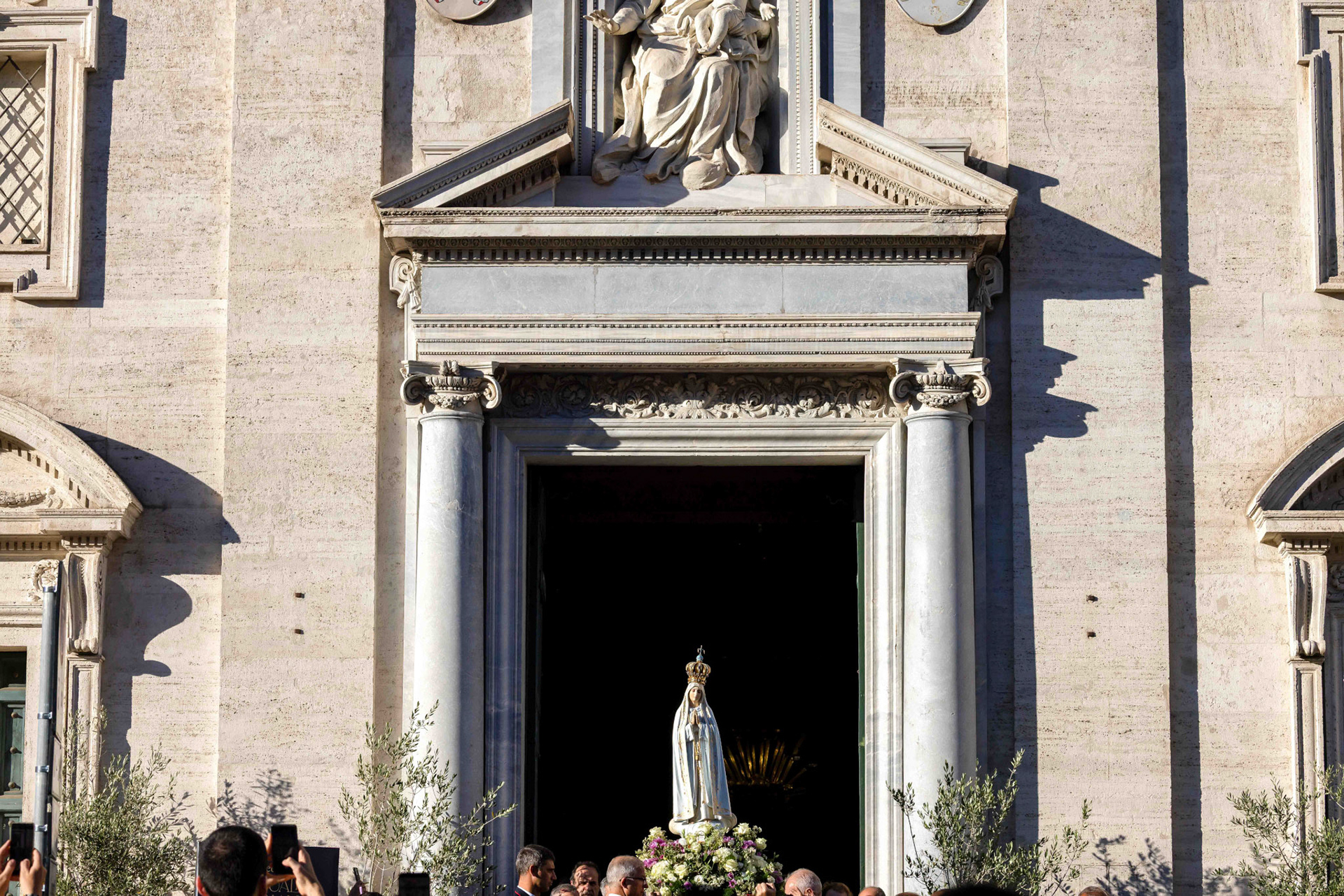 The original statue of Our Lady of Fatima is carried in procession as it leaves the Church of Santa Maria in Traspontina in Rome Oct. 11, 2025, on its way to St. Peter’s Square for a prayer vigil with Pope Leo XIV and the recitation of the rosary for peace. (CNS photo/Pablo Esparza)