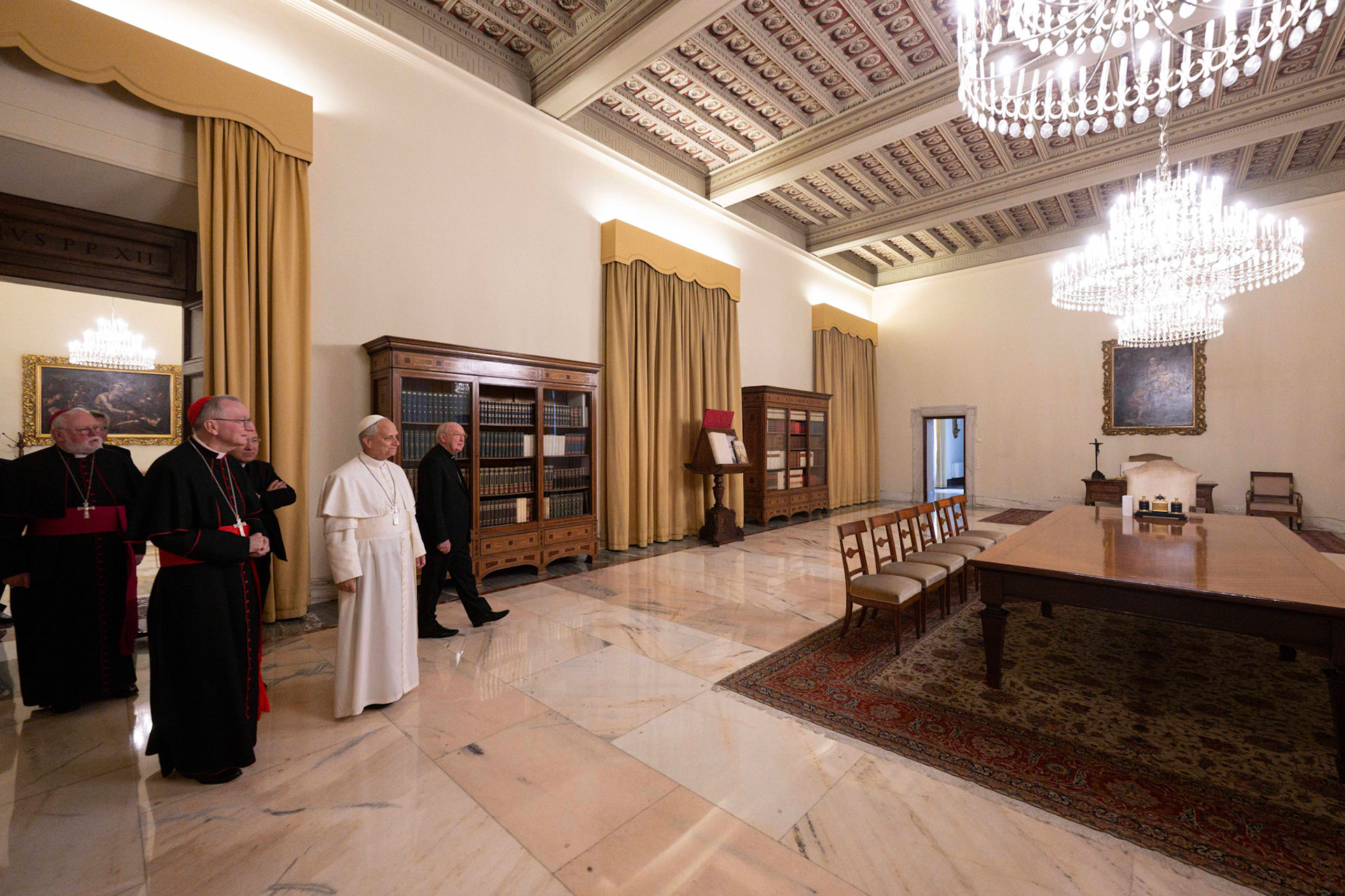 Pope Leo XIV visits one of the rooms of the papal apartment in the Apostolic Palace at the Vatican May 11, 2025, accompanied by U.S. Cardinal Kevin J. Farrell, right, and Cardinal Pietro Parolin, left. The Vatican has not said whether the new pope intends to live in the apartment. (CNS photo/Vatican Media)