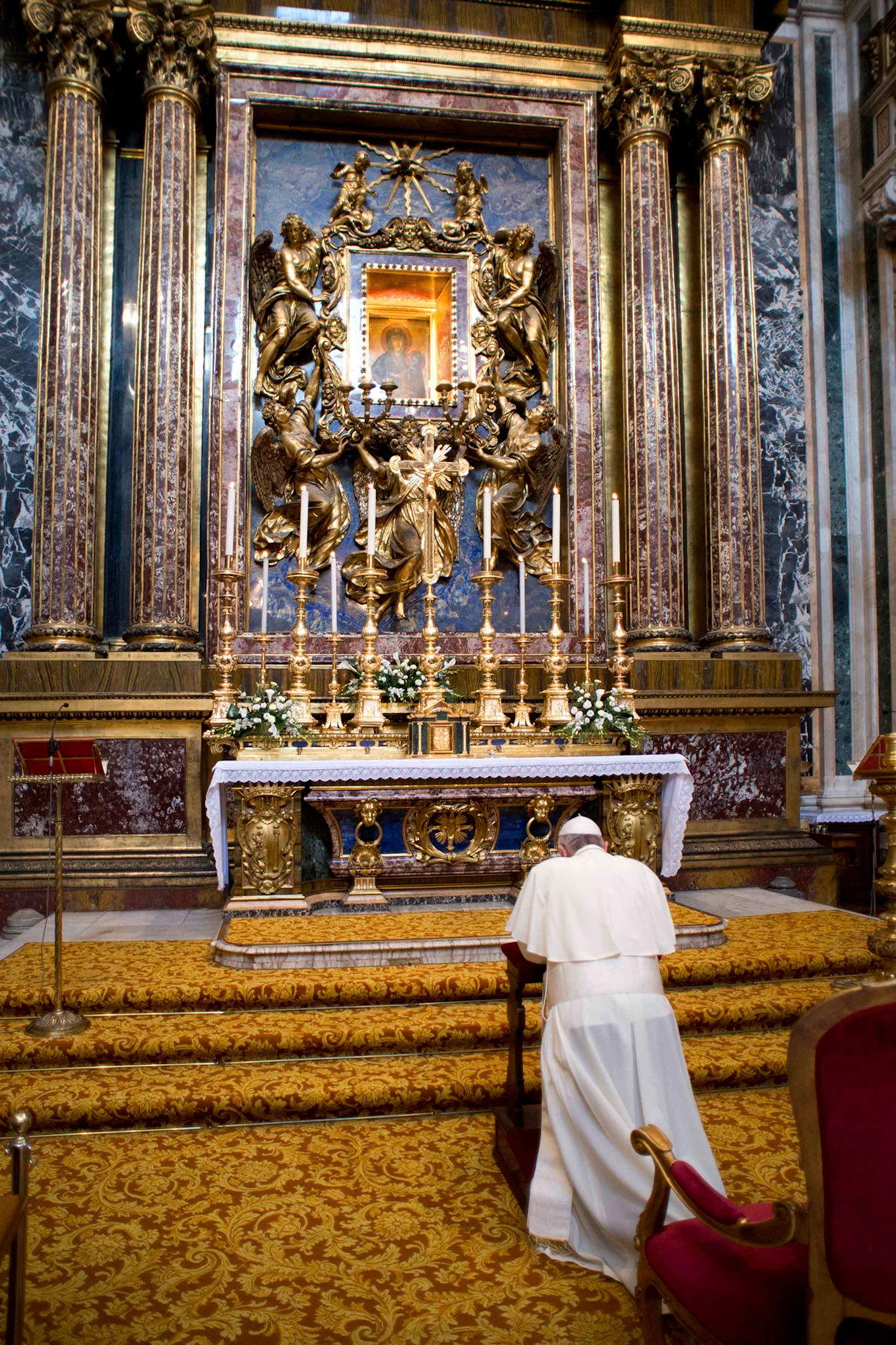 Pope Francis prays in front of the icon of "Salus Populi Romani," (health of the Roman people), at St. Mary Major Basilica in Rome July 20, 2013. Pope Francis died April 21, 2025, at age 88. He will be entombed at the basilica. (CNS photo/L'Osservatore Romano)