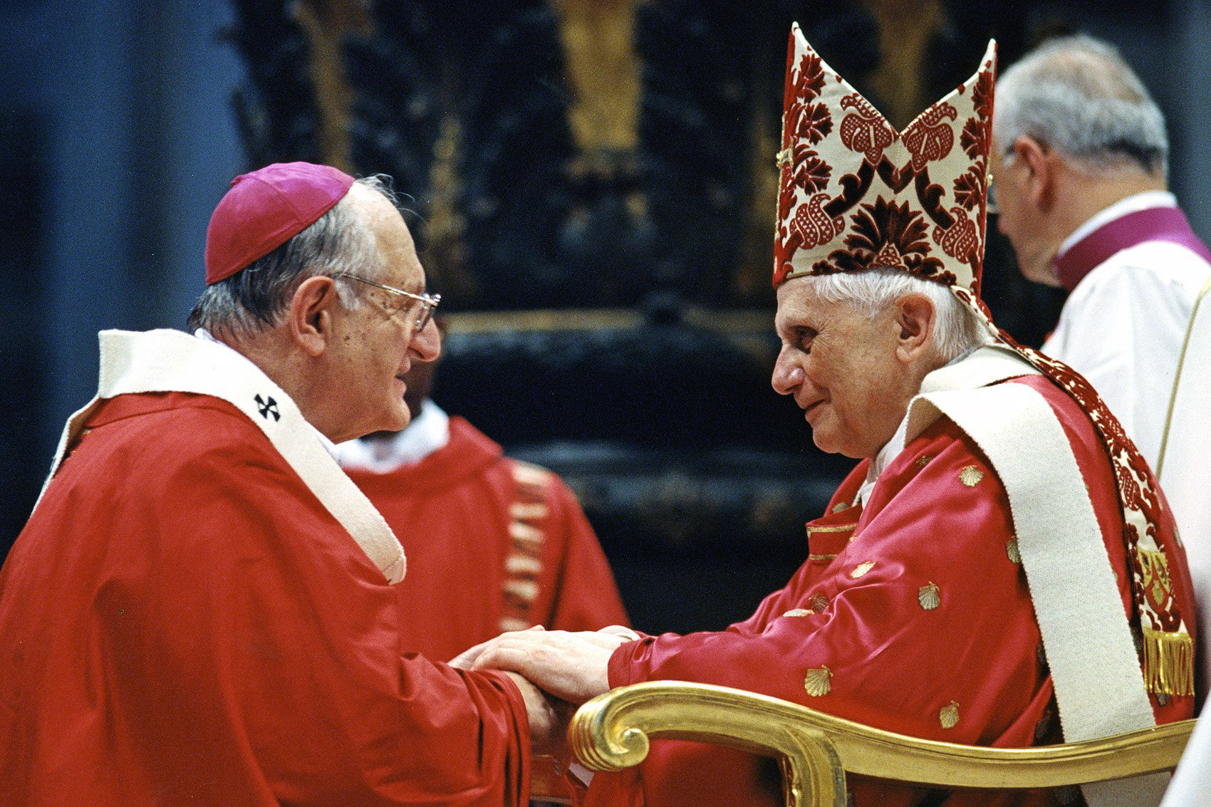 Pope Benedict XVI greets Archbishop Joseph A. Fiorenza of Galveston-Houston after bestowing the pallium on the archbishop during a Mass June 29 in St. Peter's Basilica at the Vatican. (CNS photo from Catholic Press Photo) (June 30, 2005)