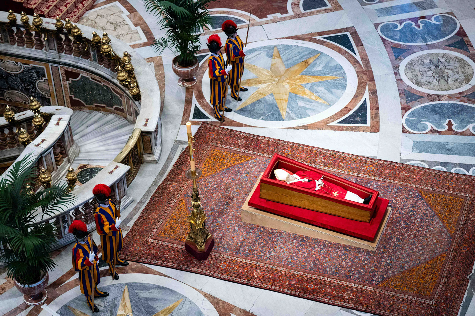 The body of Pope Francis lies in an open casket in front of the Altar of the Confession in St. Peter’s Basilica at the Vatican April 23, 2025. The pope will lie in state for three days of public viewing and prayer ahead of his funeral Mass April 26. (CNS photo/Paolo Galosi, pool)