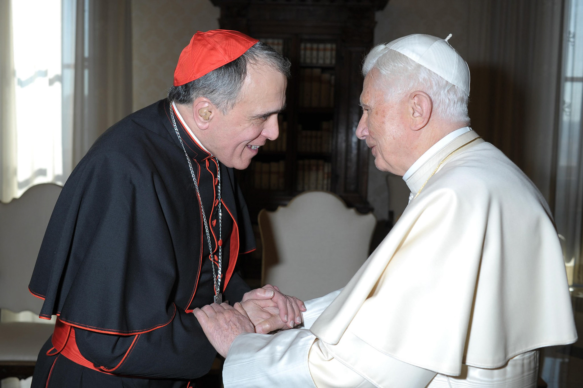 Pope Benedict XVI greets Cardinal Daniel N. DiNardo of Galveston-Houston during a March 15 meeting with Texas bishops at the Vatican. Bishops from Texas, Oklahoma and Arkansas were making their "ad limina" visits to the Vatican to report on the status of their dioceses. (CNS photo/L'Osservatore Romano) (March 15, 2012)