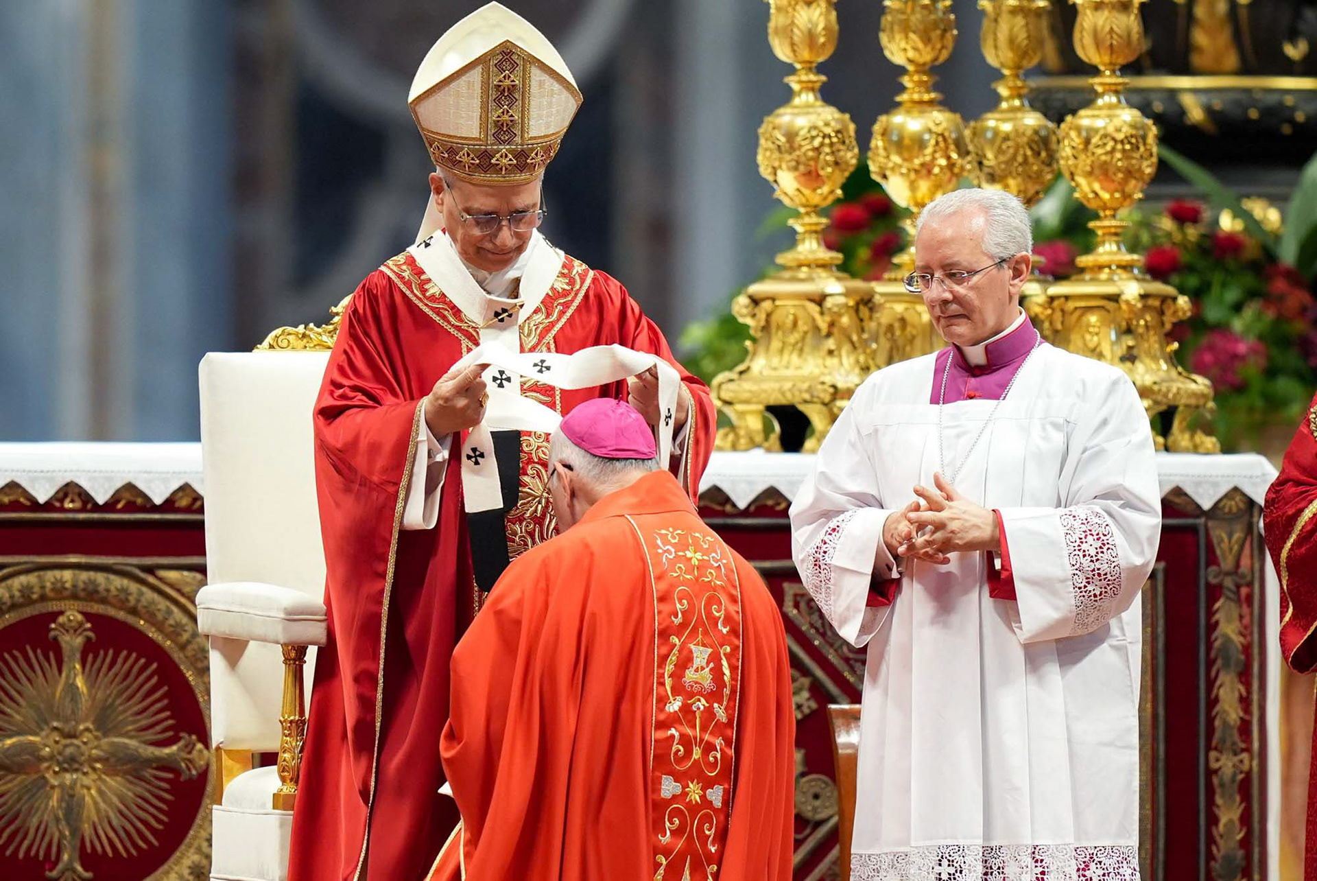 Pope Leo XIV presents the pallium to Archbishop Joe S. Vásquez of Galveston-Houston during Mass in St. Peter’s Basilica at the Vatican June 29, 2025, the feast of Sts. Peter and Paul. The pallium symbolizes the archbishop’s authority and unity with the pope. (CNS photo/Lola Gomez)