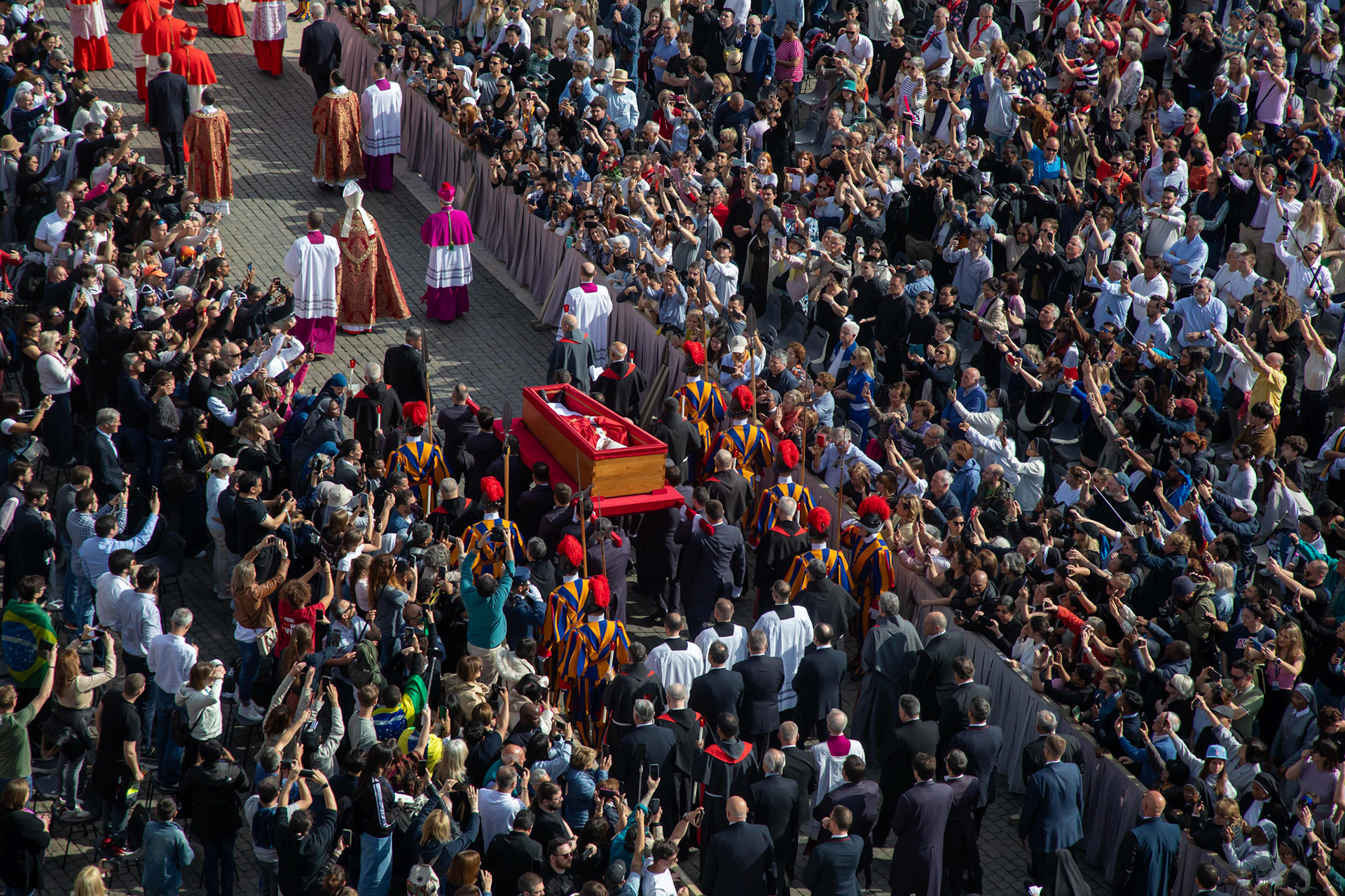 Pallbearers carry the body of Pope Francis in his casket through St. Peter's Square on their way into St. Peter's Basilica at the Vatican April 23, 2025, as the pope's mortal remains are prepared for public viewing and prayer. (CNS photo/Pablo Esparza)