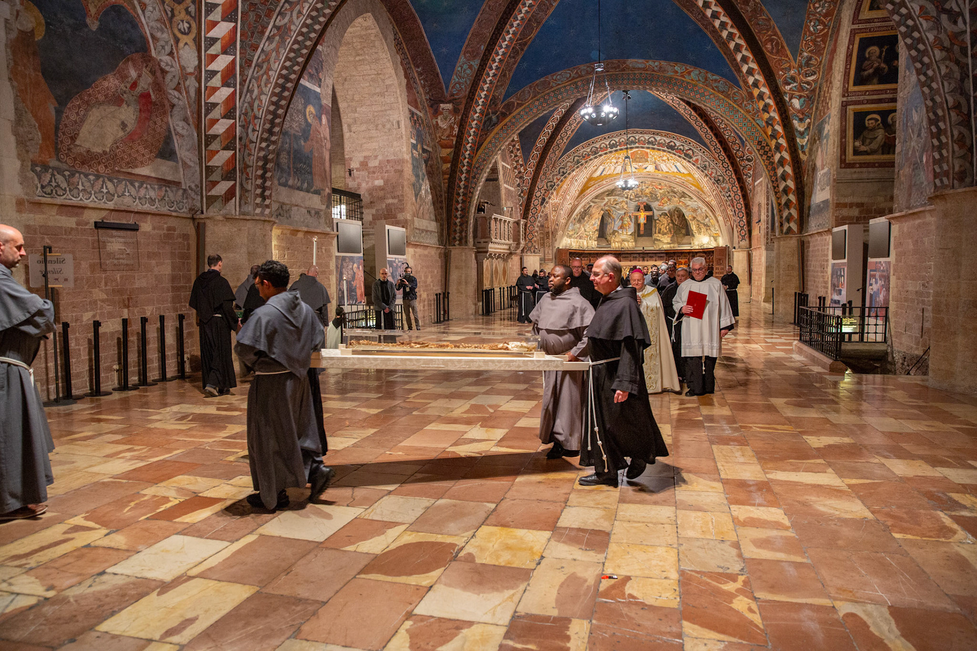 Franciscan friars carry the mortal remains of St. Francis of Assisi  in procession from the Lower Church of the Basilica of St. Francis of Assisi in Italy to the basilica's crypt after a monthlong period of public veneration ended March 22, 2026. (OSV News photo/courtesy Basilica of St. Francis of Assisi)