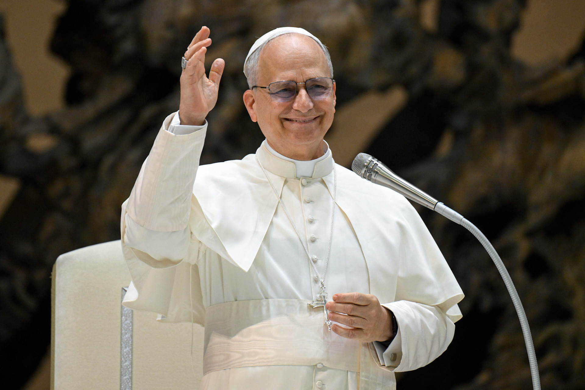 Pope Leo XIV waves during a meeting with officials and employees of the Roman Curia, Vatican City State and the Diocese of Rome in the Paul VI Audience Hall at the Vatican May 24, 2025. (CNS photo/Vatican Media)