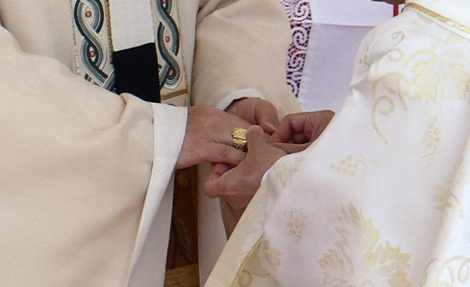 Cardinal Luis Antonio Tagle, pro-prefect of the Dicastery for Evangelization under Pope Francis, places the papal fisherman's ring on Pope Leo XIV, formerly Cardinal Robert Francis Prevost, as the pontiff celebrates his inauguration Mass at the Vatican May 18, 2025. He is the first American pope in history. (OSV News photo/Guglielmo Mangiapane, Reuters)