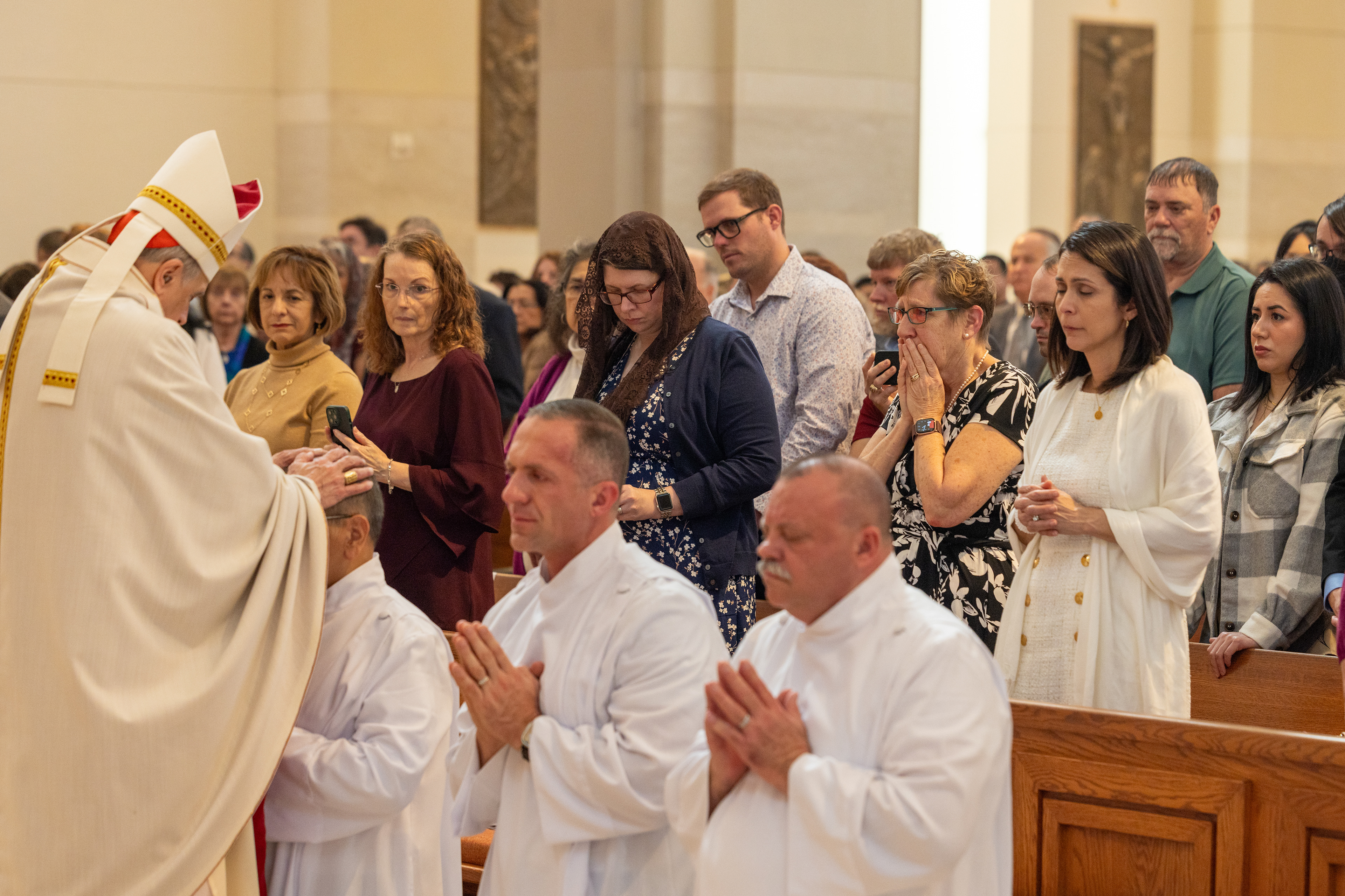 Cardinal DiNardo ordains a new permanent deacon during an Ordination Mass in February. (Photo by James Ramos/Herald)