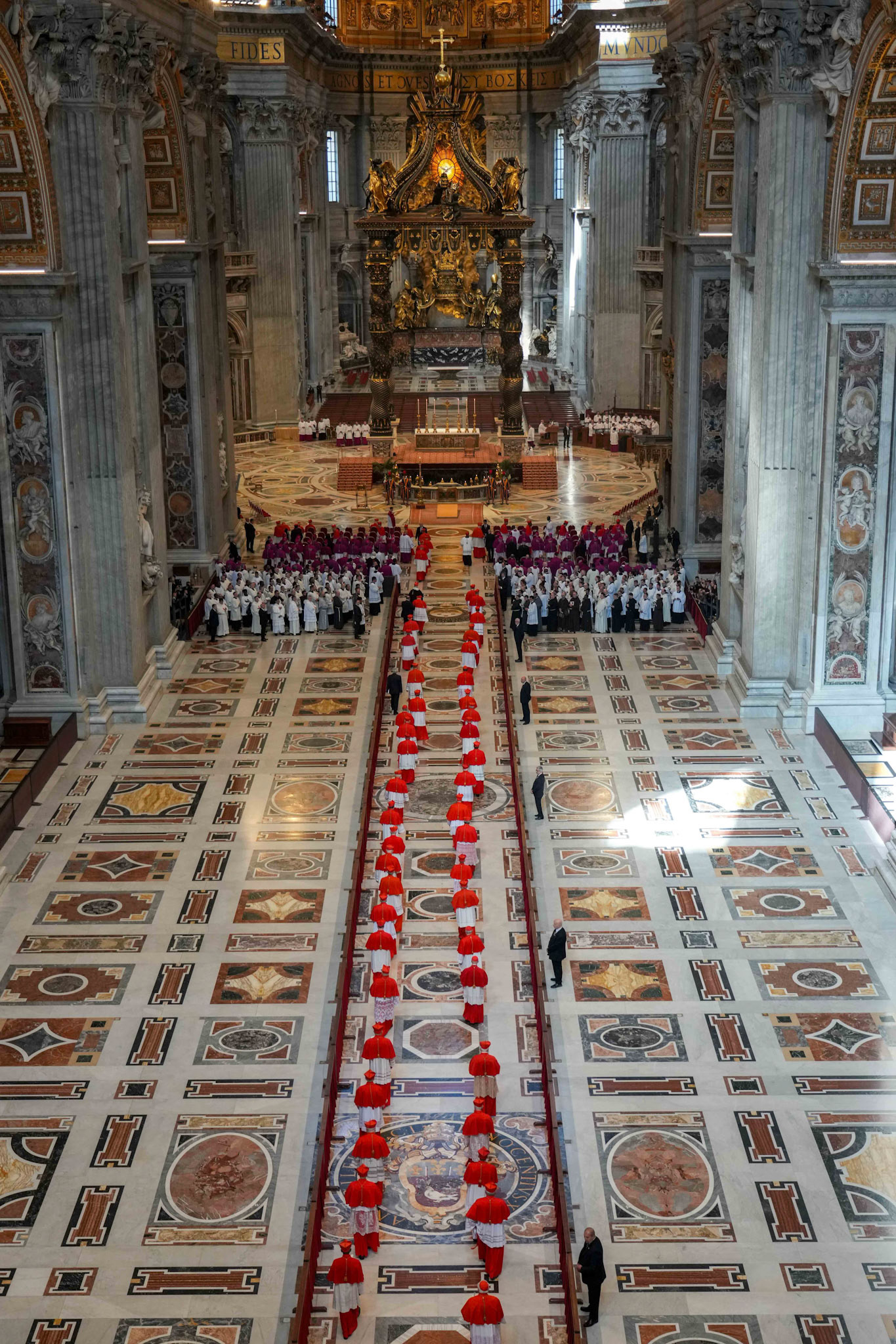 Cardinals enter in procession before the body of Pope Francis arrives in St. Peter’s Basilica at the Vatican April 23, 2025. The pope, in an open casket, will lie in the basilica for public viewing and prayer for three days before his funeral Mass April 26, 2025. (CNS photo/Lola Gomez)