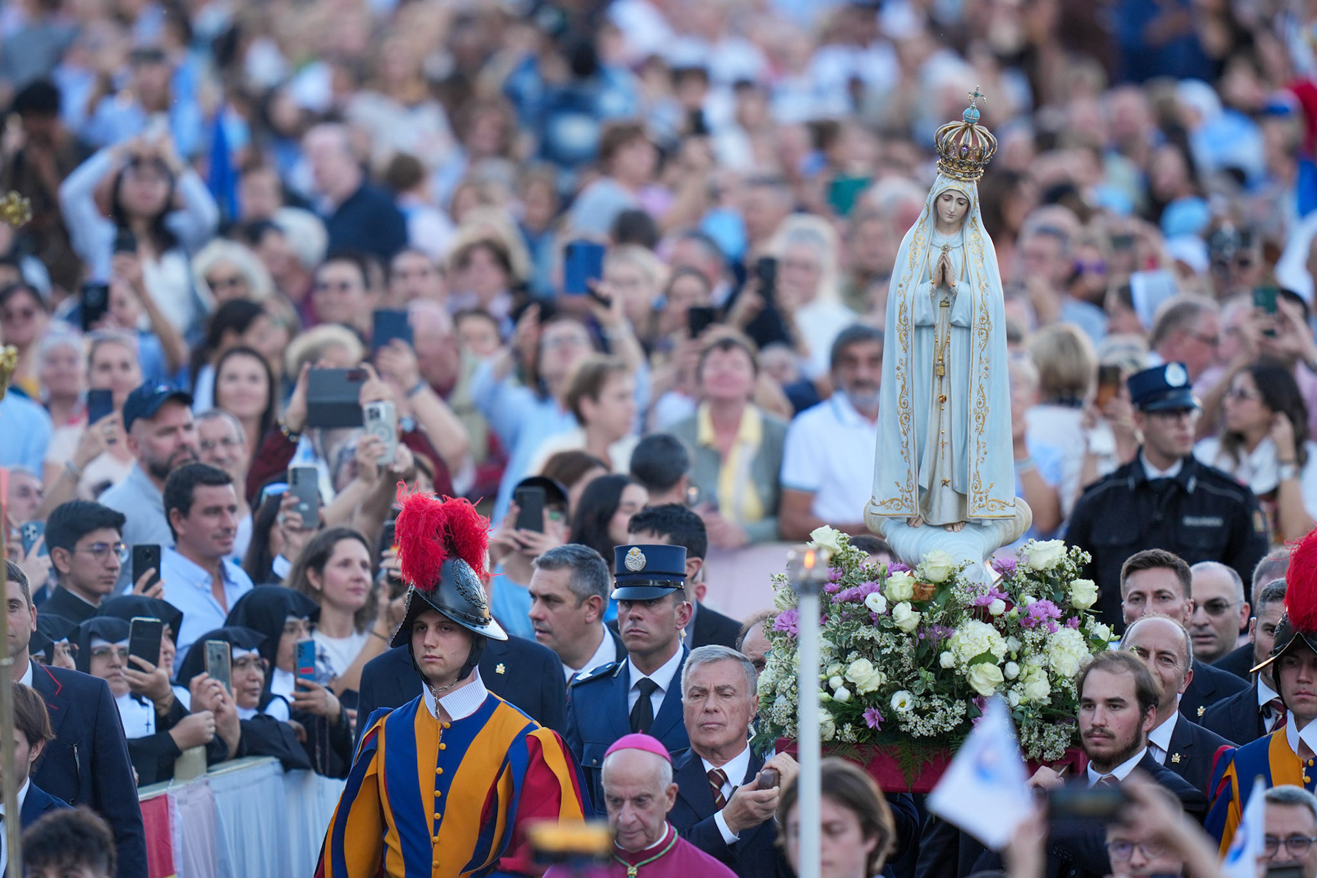 The original statue of Our Lady of Fatima, with one of the bullets from the attempted assassination in 1981 of St. John Paul II embedded in its crown, is carried in procession in St. Peter's Square at the Vatican for a prayer vigil with Pope Leo XIV Oct. 11, 2025. (CNS photo/Lola Gomez)