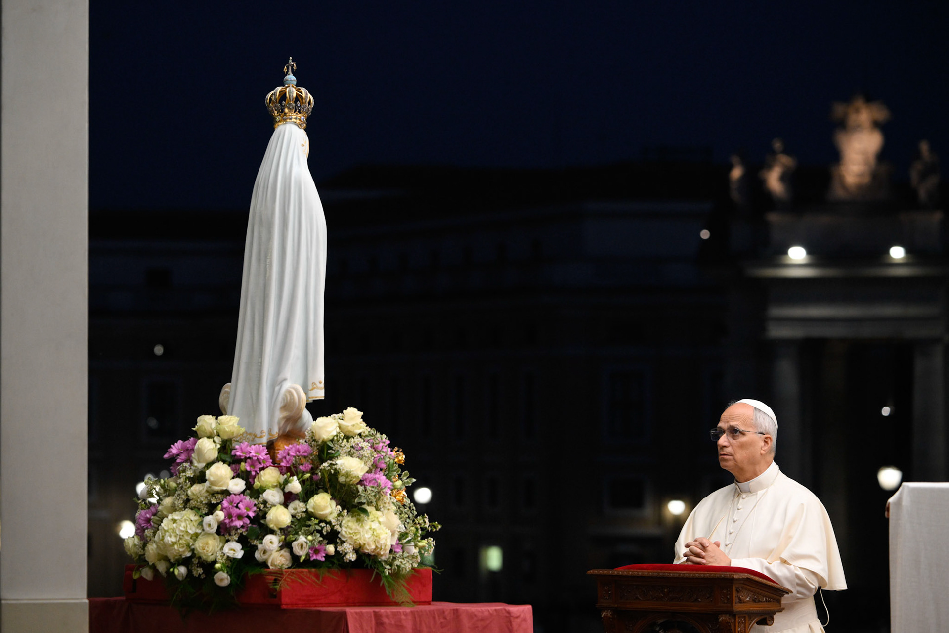 Pope Leo XIV kneels in prayer before the original statue of Our Lady of Fatima in St. Peter's Square at the Vatican Oct. 11, 2025, before a prayer vigil and the recitation of the rosary for peace. The statue was brought from Portugal to Rome for the Jubilee of Marian Spirituality. (CNS photo/Vatican Media)