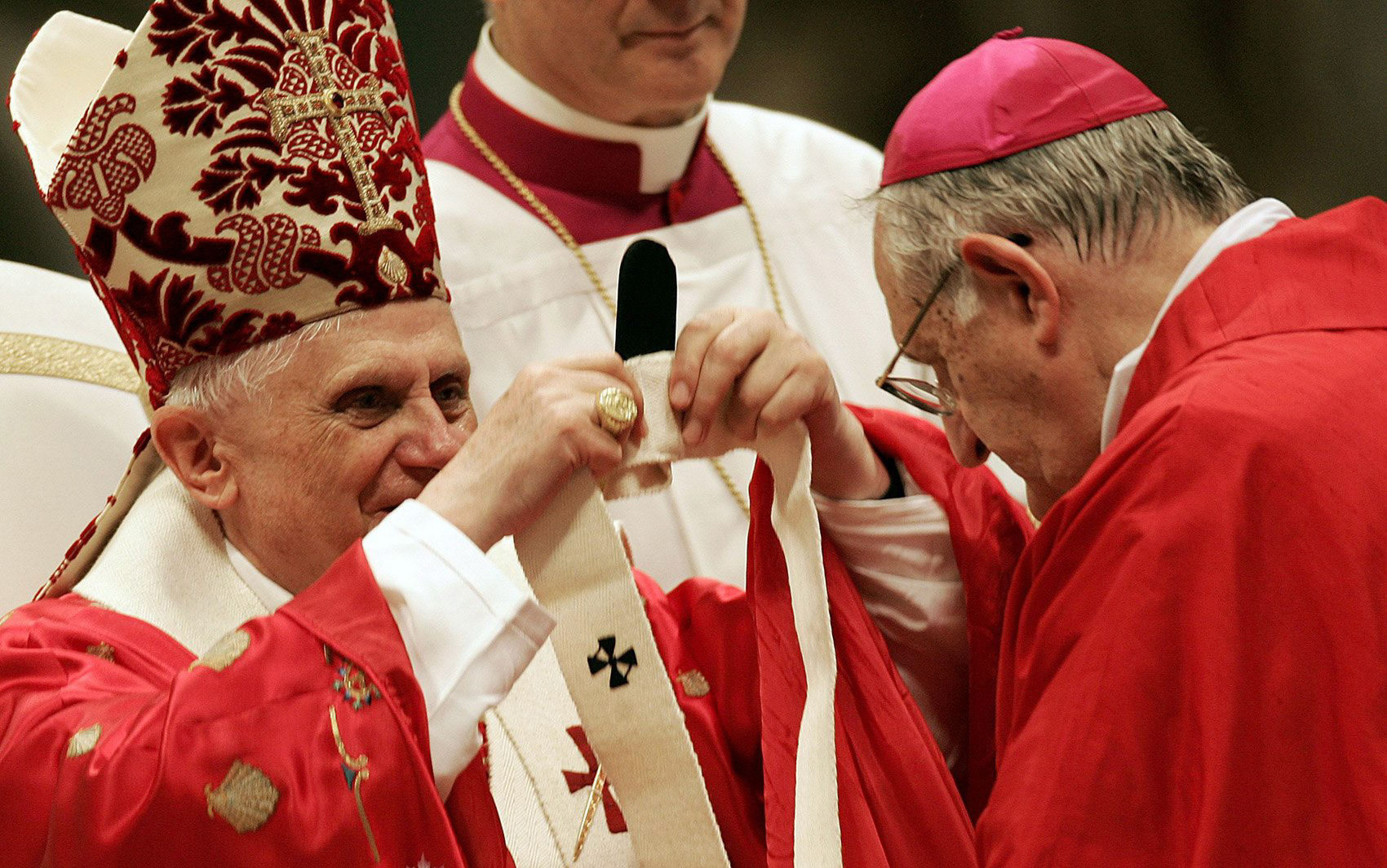 Pope Benedict XVI presents Archbishop Joseph A. Fiorenza of Galveston-Houston with a pallium during Mass in St. Peter's Basilica at the Vatican June 29, 2005. The pallium is a symbol of the archbishop's authority and unity with the pope. (CNS photo from Reuters)