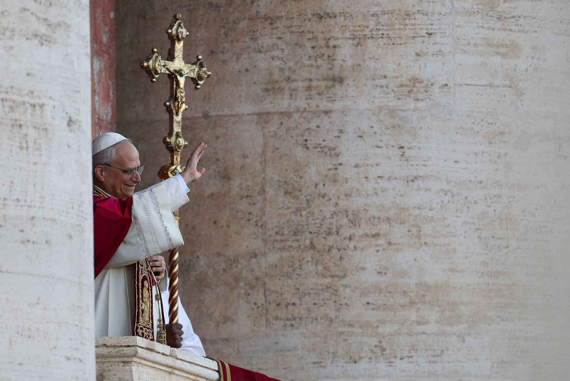 Cardinal Robert Francis Prevost, who has chosen the papal name Leo XIV, waves to the crowd on the central balcony of St. Peter's Basilica at the Vatican May 8, 2025, following his election during the conclave. He is the first American pope in history. (OSV News photo/Stoyan Nenov, Reuters)