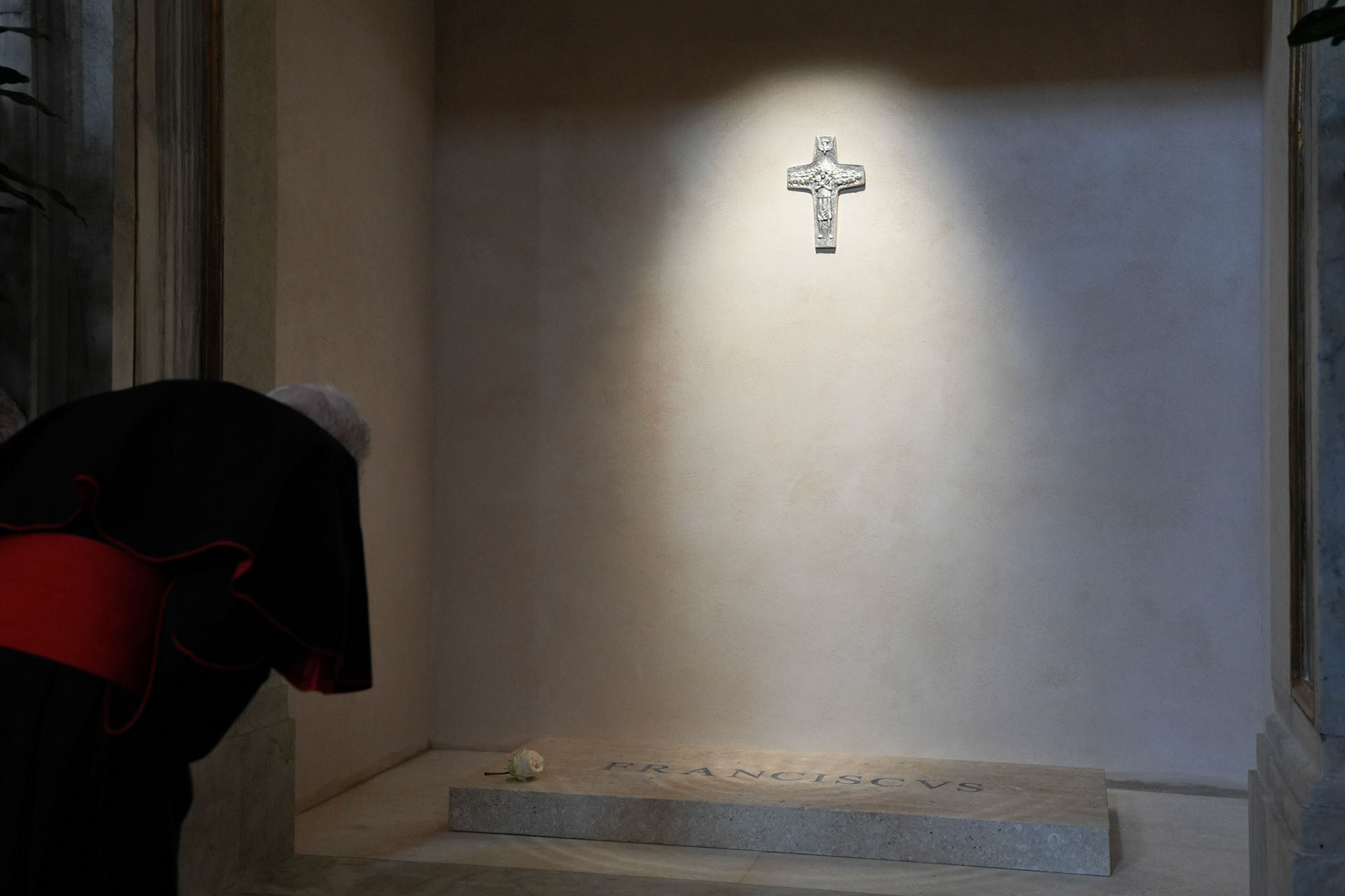 A member of the College of Cardinals prays at the tomb of Pope Francis and attends vespers at the Basilica of St. Mary Major in Rome April 27, 2025. Cardinals and the faithful visited the Marian basilica to offer their prayers and respects. (CNS photo/Lola Gomez)