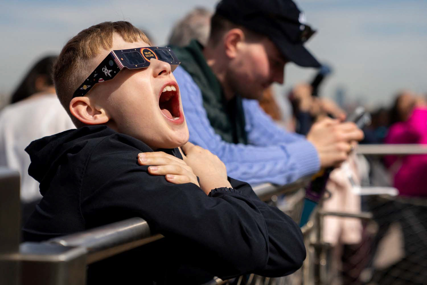 A boy reacts during the partial solar eclipse at Liberty Island in New York City April 8, 2024. A partial eclipse was visible throughout all 48 contiguous U.S. states, while a total solar eclipse was visible along a narrow track stretching from Texas to Maine. (OSV News photo/David Dee Delgado, Reuters)
