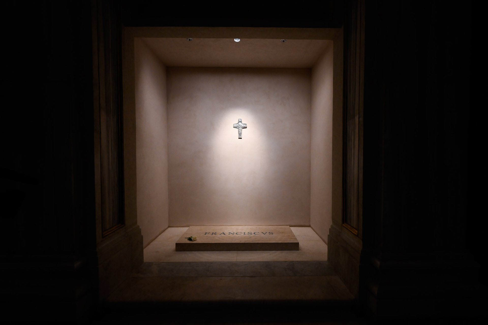 A light shines on a replica of Pope Francis' pectoral cross above his tomb in the side aisle of Rome's Basilica of St. Mary Major early April 27, 2025. (CNS photo/Vatican Media)