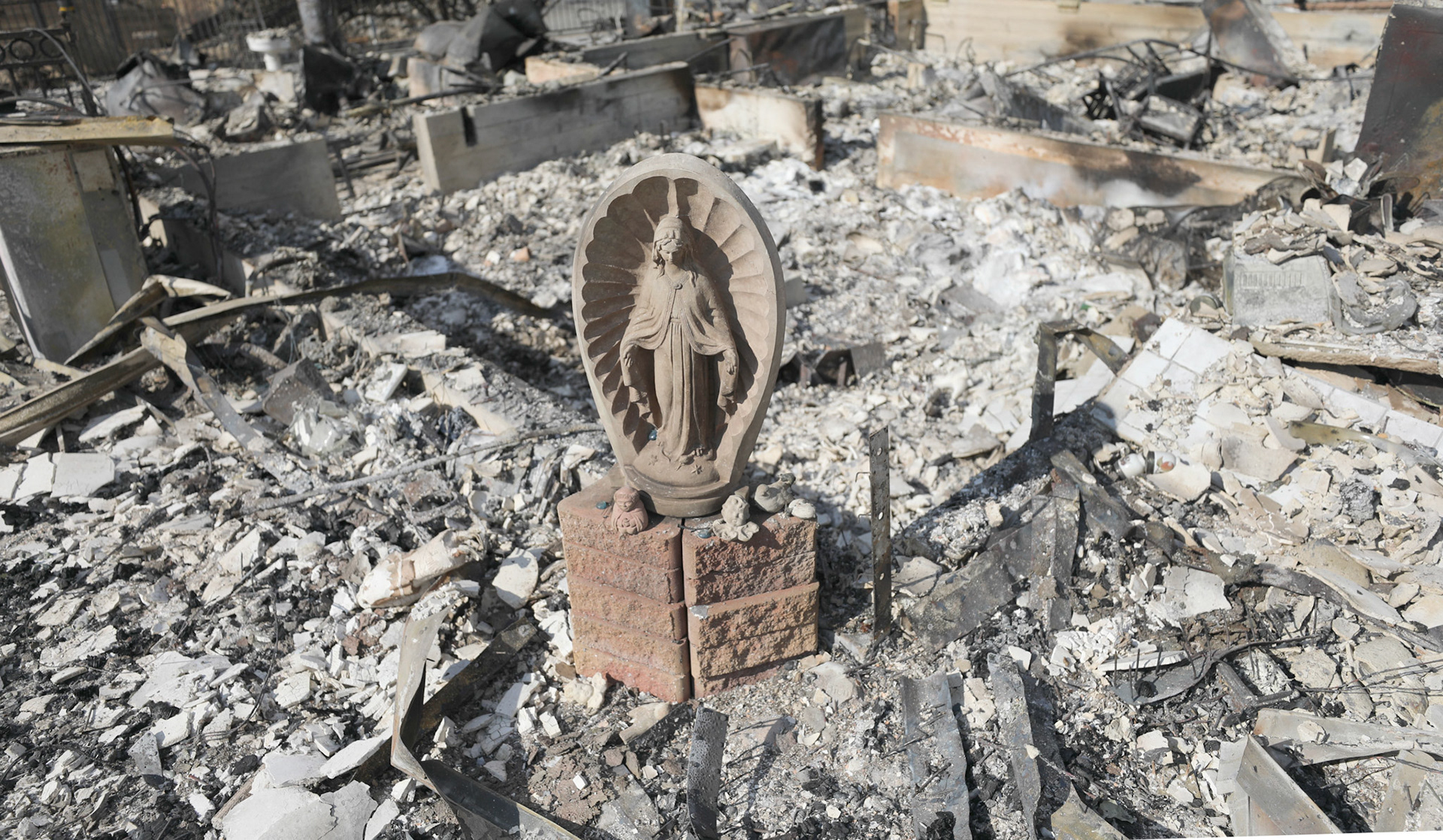 A statue of Mary rests nearly untouched in the rubble of a destroyed home in Altadena, Calif., Jan. 17, 2025, in the aftermath of the Eaton Fire, which began Jan. 7. Fires across the Los Angeles area have killed at least 27 people, destroyed more than 12,000 structures and charred more than 60 square miles. The Palisades and Eaton wildfires continue to burn as of Jan. 17. (OSV News photo/Bob Roller)
