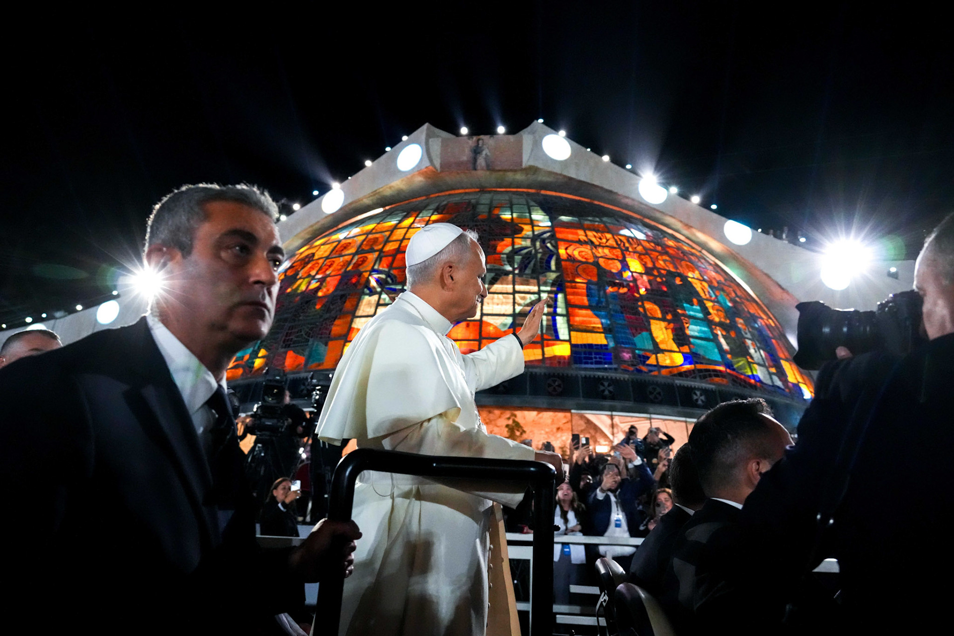 Pope Leo XIV greets the crowd from a mini popemobile during an event with Lebanese young people in the square in front of the Maronite Patriarchate of Antioch in Bkerké, Lebanon, Dec. 1, 2025. (CNS photo/Lola Gomez)