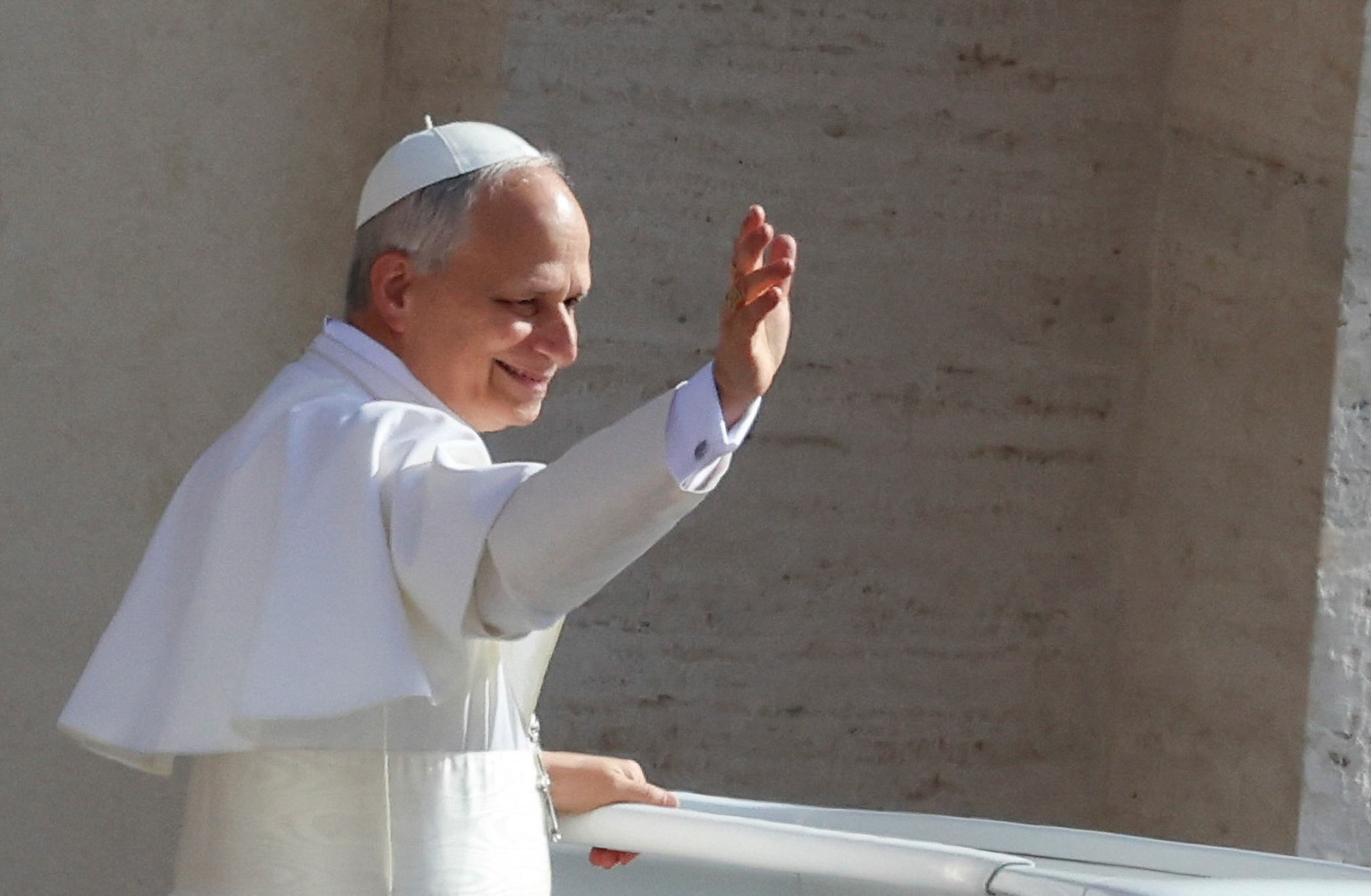 Pope Leo XIV, formerly Cardinal Robert Francis Prevost, waves as he arrives to celebrate his inauguration Mass at the Vatican May 18, 2025. He is the first American pope in history. (OSV News photo/Claudia Greco, Reuters)