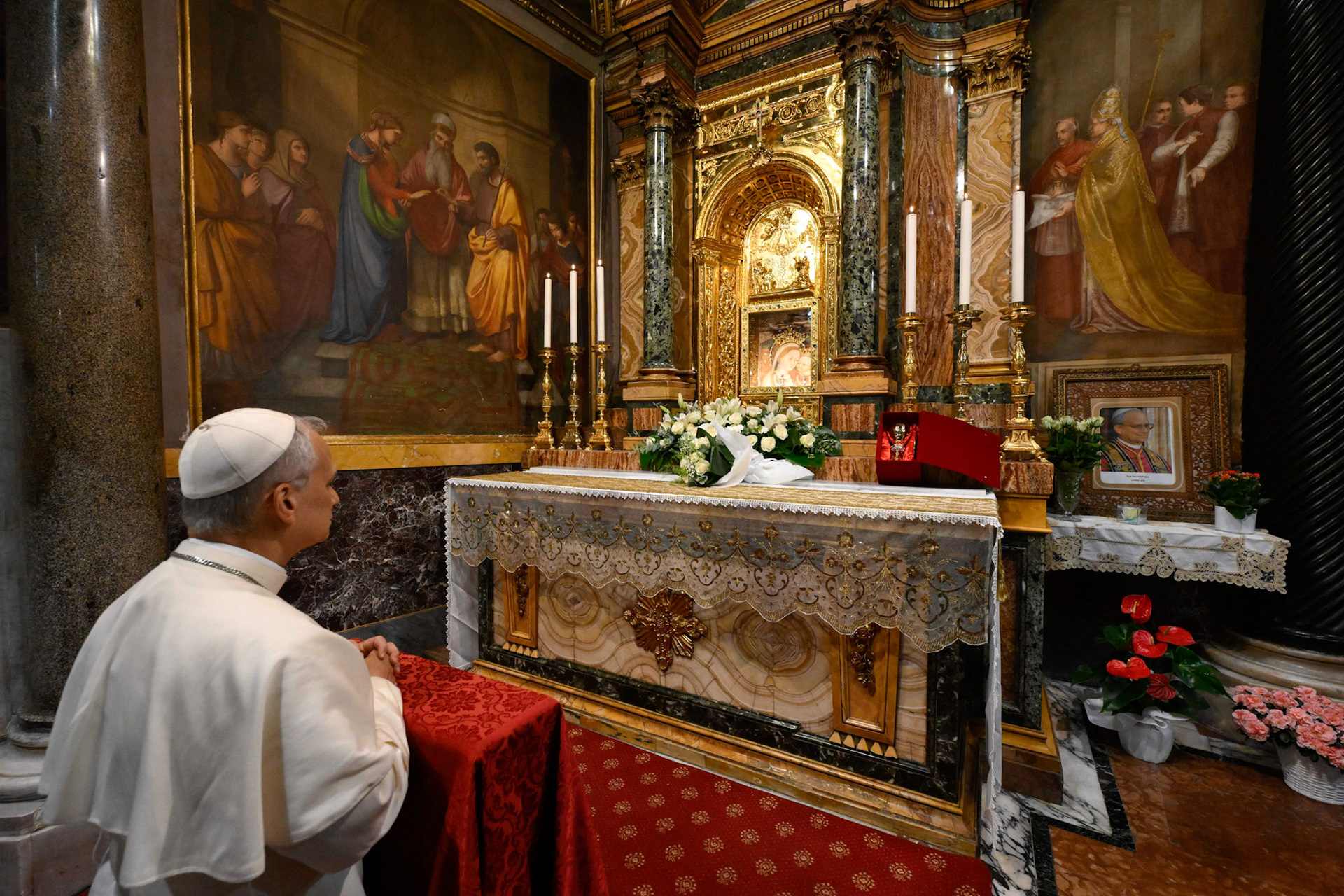 Pope Leo XIV prays in front of a fresco of Our Lady of Good Counsel at the shrine named after the image in Genazzano, Italy, southeast of Rome, May 10, 2025. The shrine, with a famous image of Mary, is run by the pope's Augustinian confreres. (CNS photo/Vatican Media)
