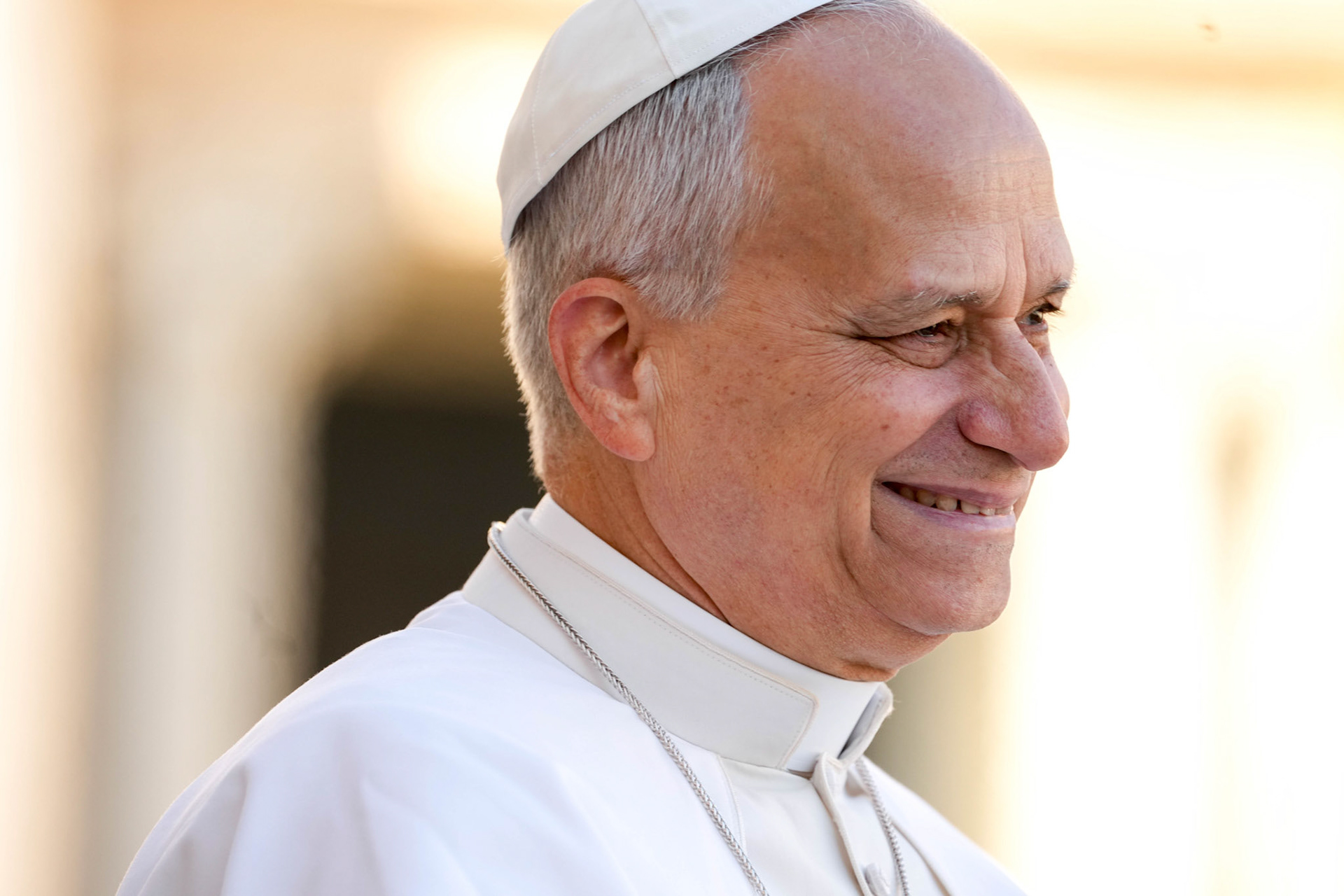 Pope Leo XIV smiles as he greets visitors and pilgrims from the popemobile as he rides around St. Peter's Square at the Vatican before his weekly general audience Dec. 10, 2025. (CNS photo/Lola Gomez)