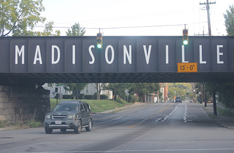 Beloved Madisonville sign on the train tracks