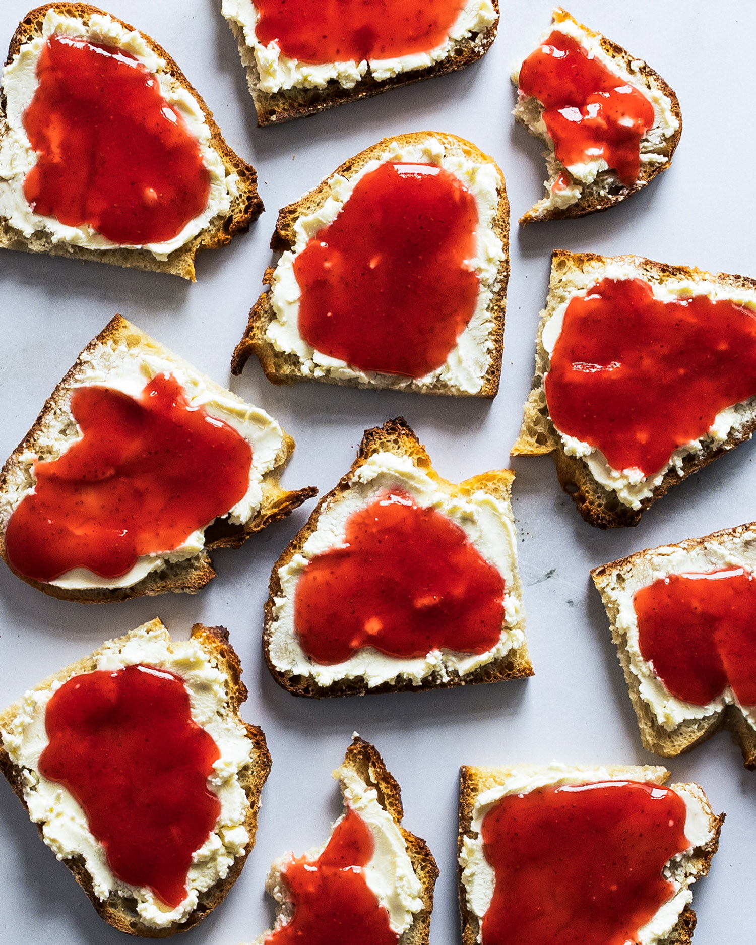 Bread with cream cheese and fresh, home made strawberry jam.
