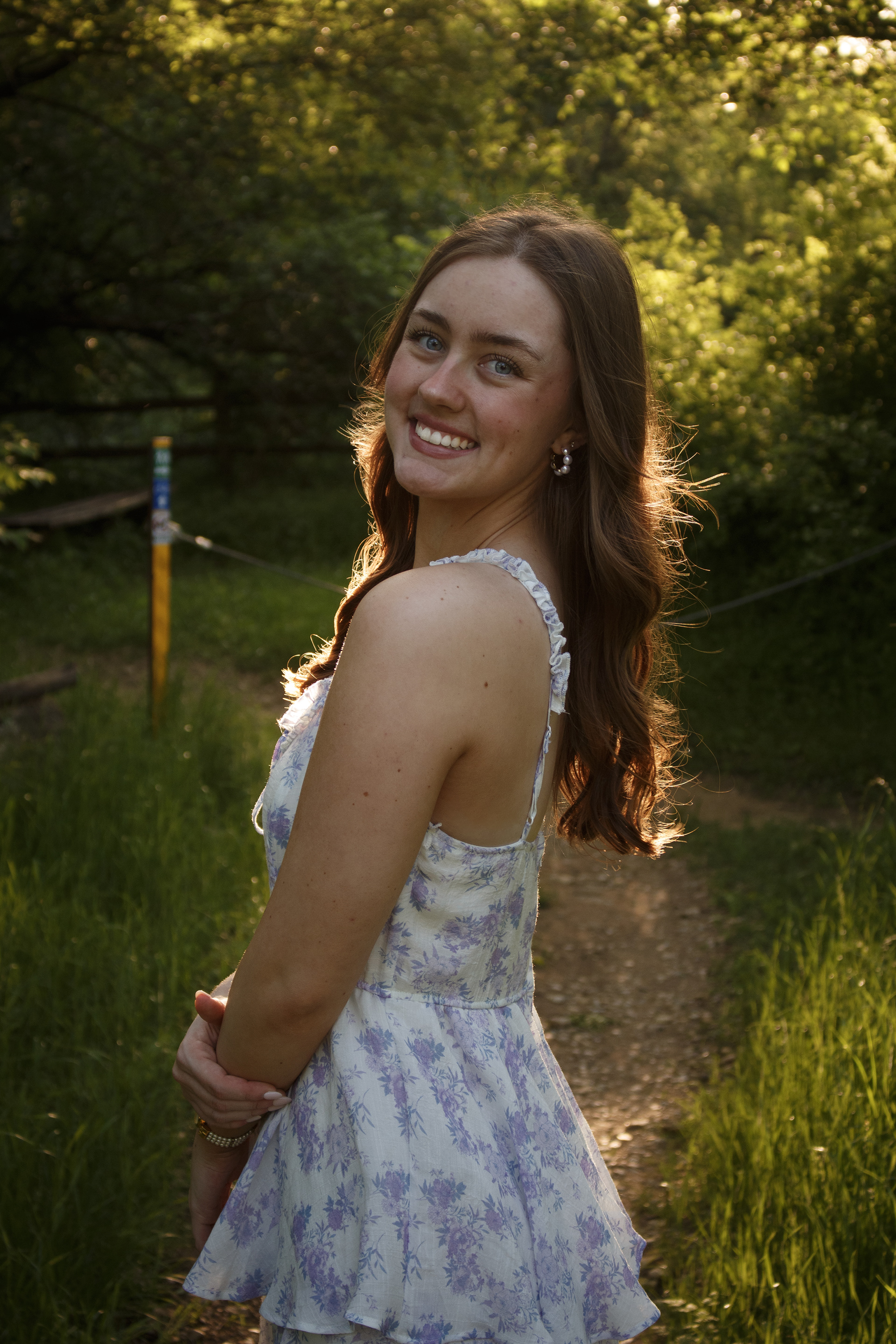 Graduate Jade Winn smiles during her portrait session at the Arbor Hills Nature Preserve in Plano, Texas on April 13, 2024. Winn plans to include these portraits in her graduation announcements. Photo/ Natalie VanDerWal
