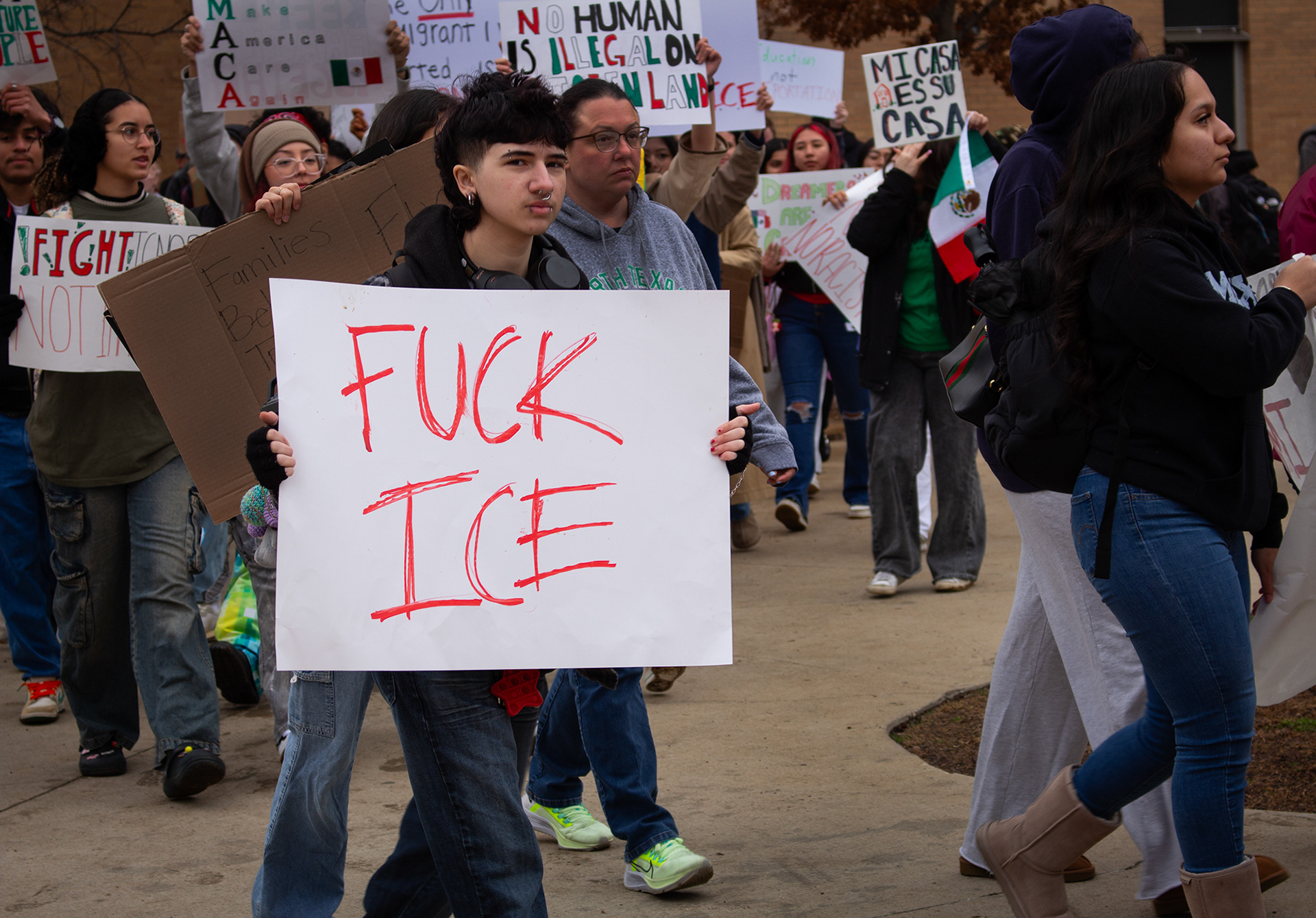One of many protesters at the walk-out protest on Wednesday, Feb. 12 at the University of North Texas holds a sign with a strongly-worded message that proclaims "Fuck ICE." This protest was hosted by several activist groups and political university organizations, including the UNT Puerto Rican Student Association, the UNT Hispanic Student Association, the DFW Anti-War Committee and the UNT Young Democratic Socialists of America club. Photo/ Natalie VanDerWal
