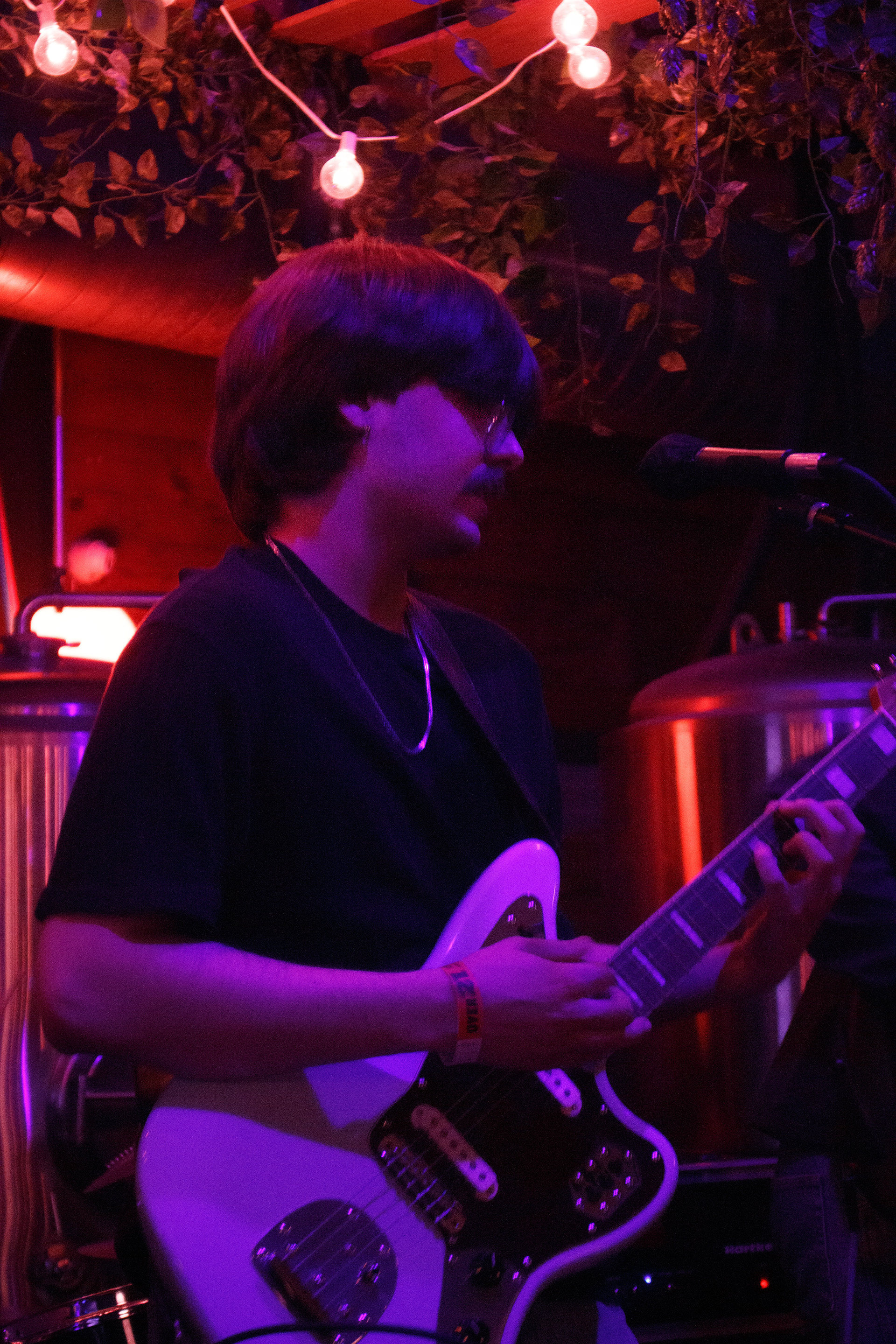 Bruno Philippon sings and plays guitar at his first independent show as a musician on March 22, 2024 at Craft and Growler in Dallas, Texas. Philippon goes by Colby Sweatshirt professionally. Photo/ Natalie VanDerWal
