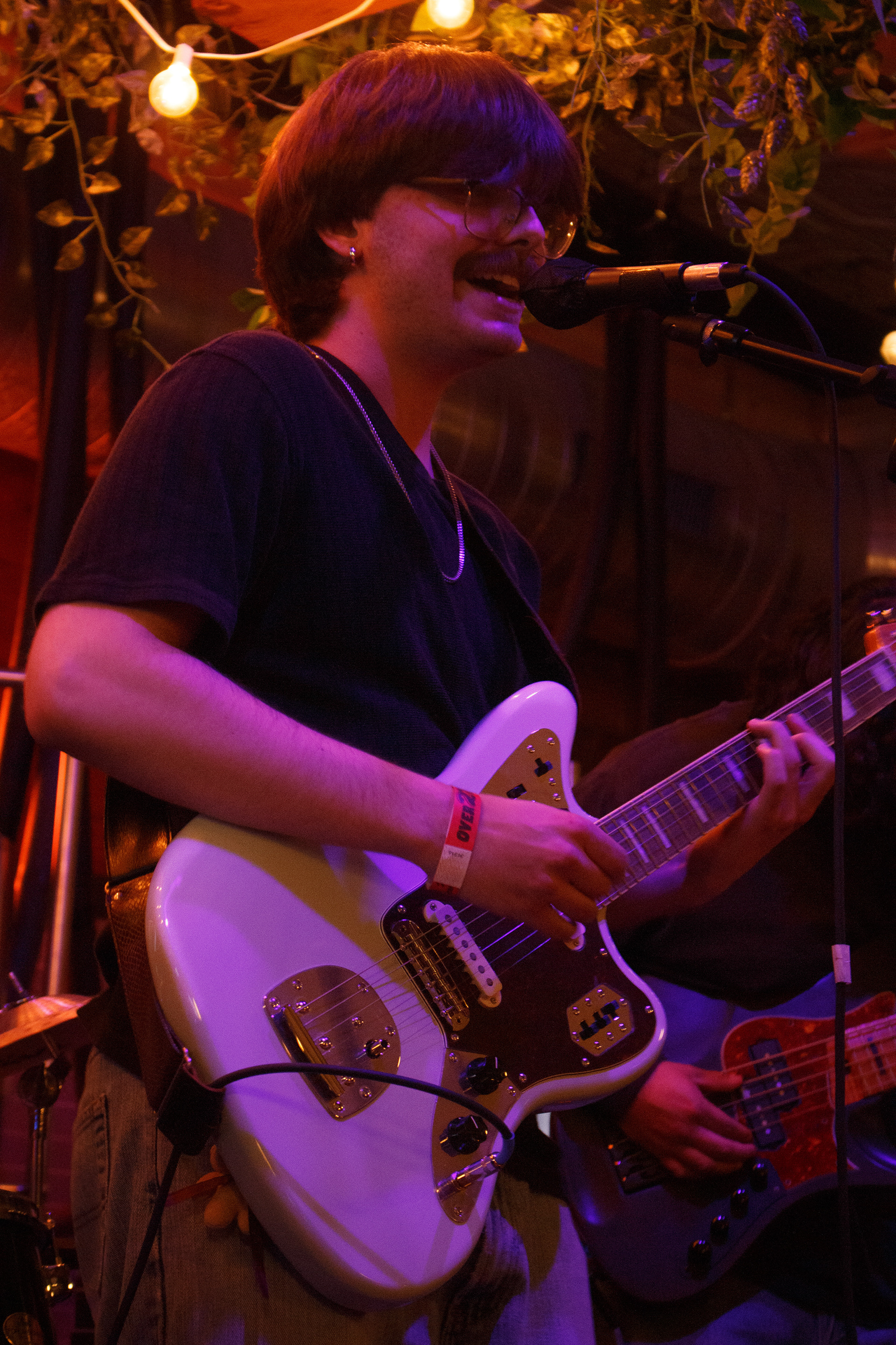 Bruno Philippon sings the first single released off his EP, "Warm Hug Demos," titled, "Baby Don't Go," at his first independent show at Craft and Growler in Dallas, Texas on March 22, 2024. Photo/ Natalie VanDerWal