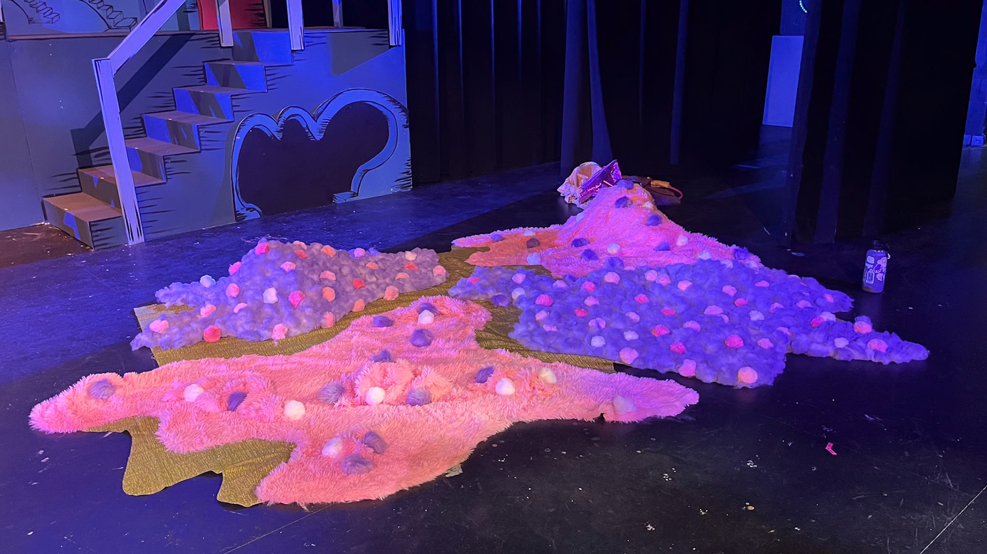 The clover field 100 miles wide, made of recycled fabric, stuffing, pom-poms, and determination