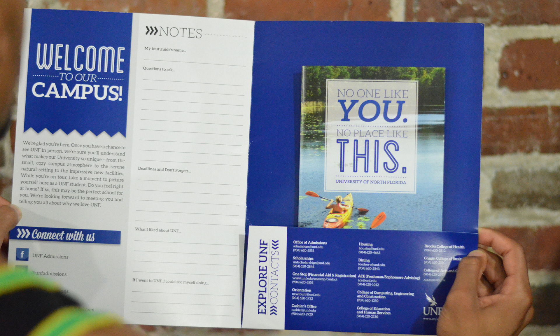 Inside view of the Admissions tour folder with the Out-of-State Viewbook inside