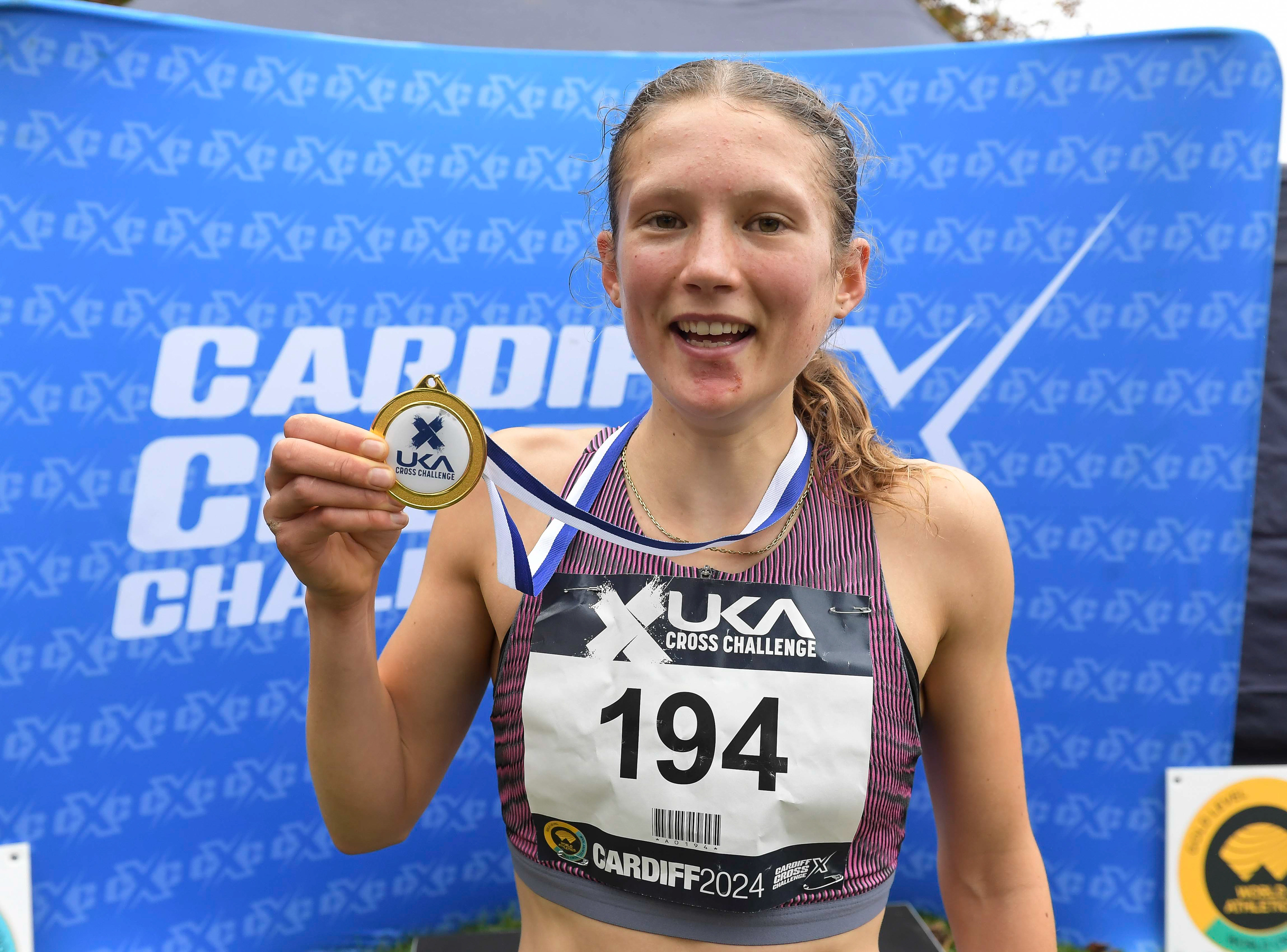 Innes FitzGerald (1st) U20 women’s medal presentation at the Cardiff Cross Challenge inc World Athletics Cross Country Tour (Gold Label), Llandaff Fields, Cardiff, Wales on the 9th November 2024