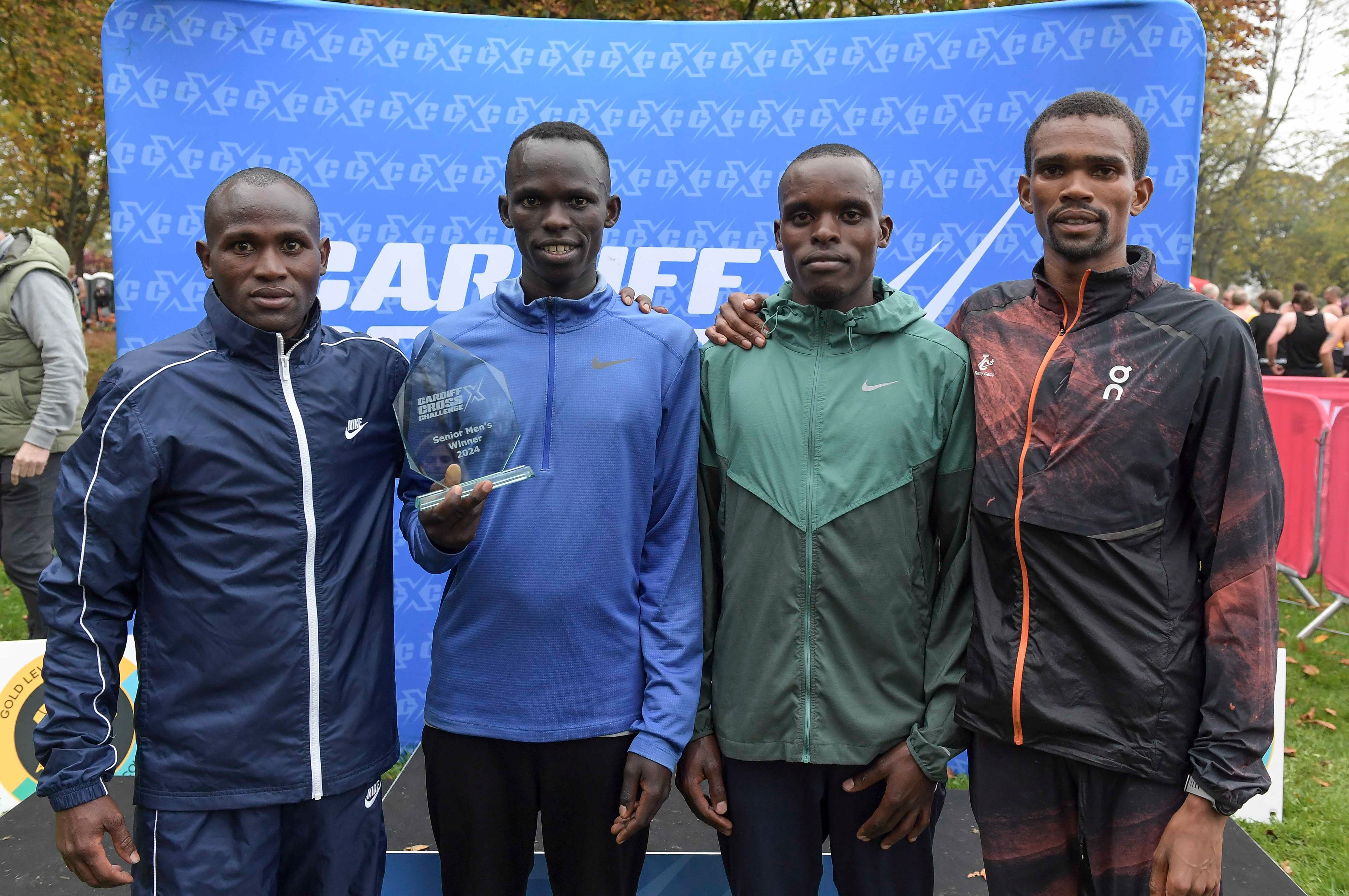 Vincent Mutai (Kenya)< Keneth Kiprop (Uganda), Daniel Kibet (Uganda) and Celestin Ndikumana (Burundi) trophy ceremony at the Cardiff Cross Challenge inc World Athletics Cross Country Tour (Gold Label), Llandaff Fields, Cardiff, Wales on the 9th November 2024