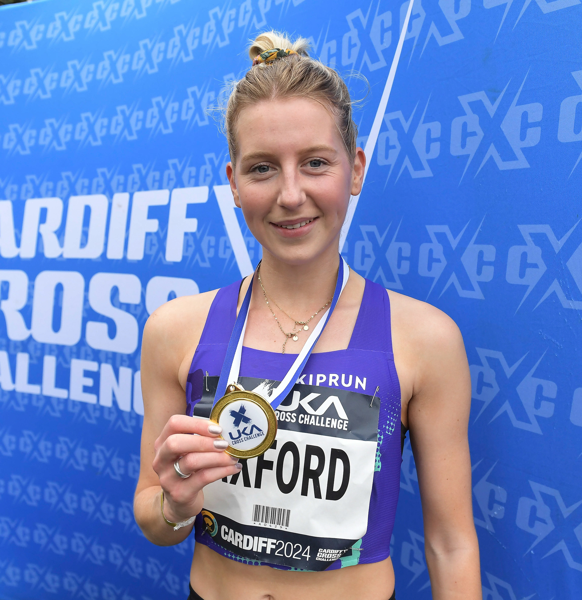 Kate Axford (1st) senior women’s medal presentation at the Cardiff Cross Challenge inc World Athletics Cross Country Tour (Gold Label), Llandaff Fields, Cardiff, Wales on the 9th November 2024